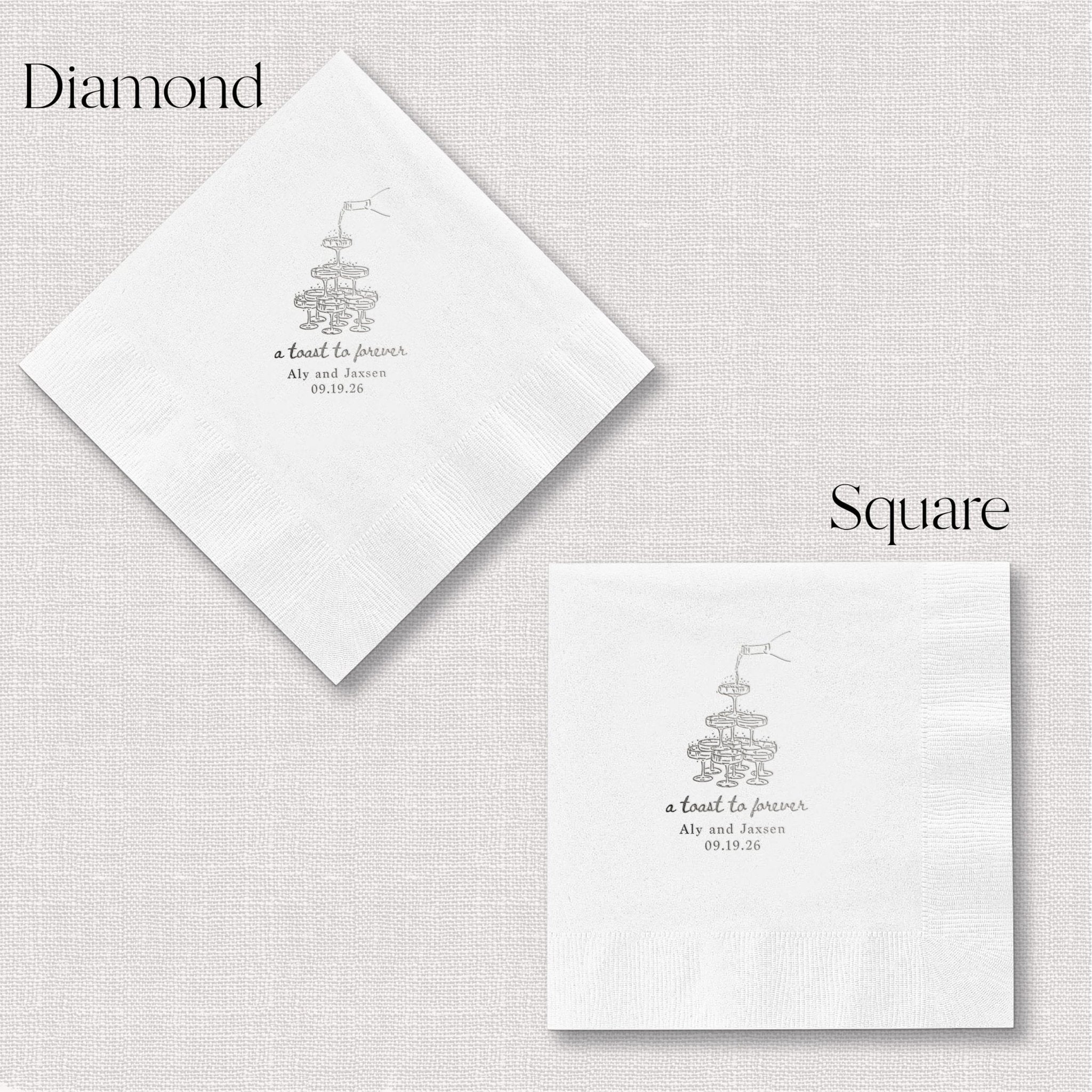 White foil-stamped napkins in diamond and square shapes with champagne glass design and "A toast to forever" text.