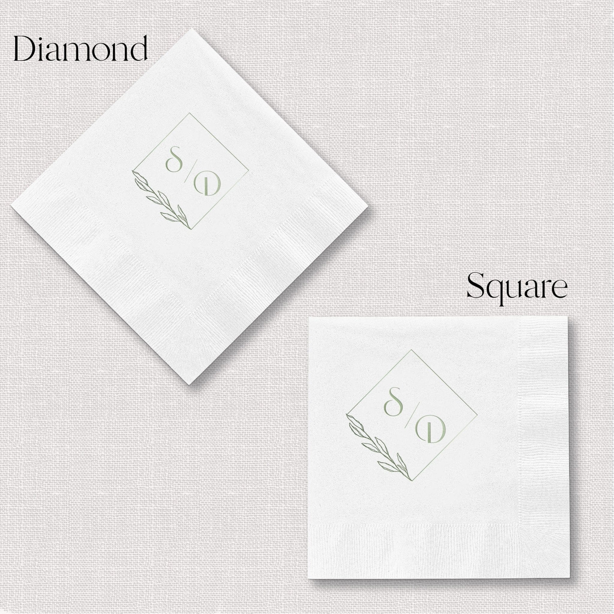 White foil-stamped napkins in diamond and square shapes with monogram and leaf design