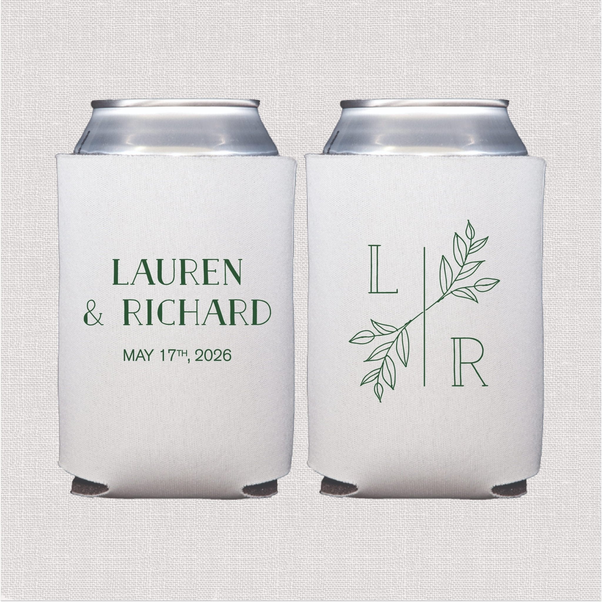 Two white can coolers with green botanical designs and personalized text reading "Lauren & Richard May 17th 2026" and monogram "L&R" with leafy accents.
