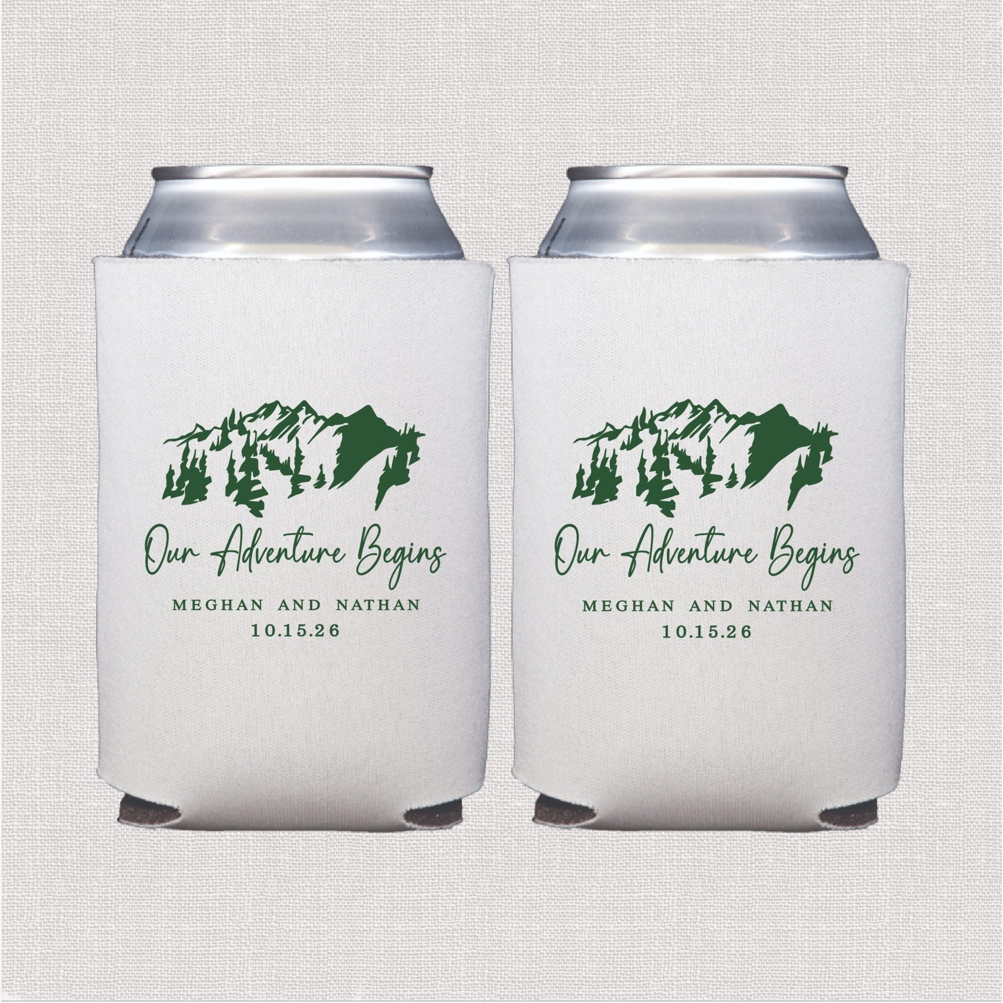 White foam can coolers with green mountain design and "Our Adventure Begins" text personalized with names and wedding date.