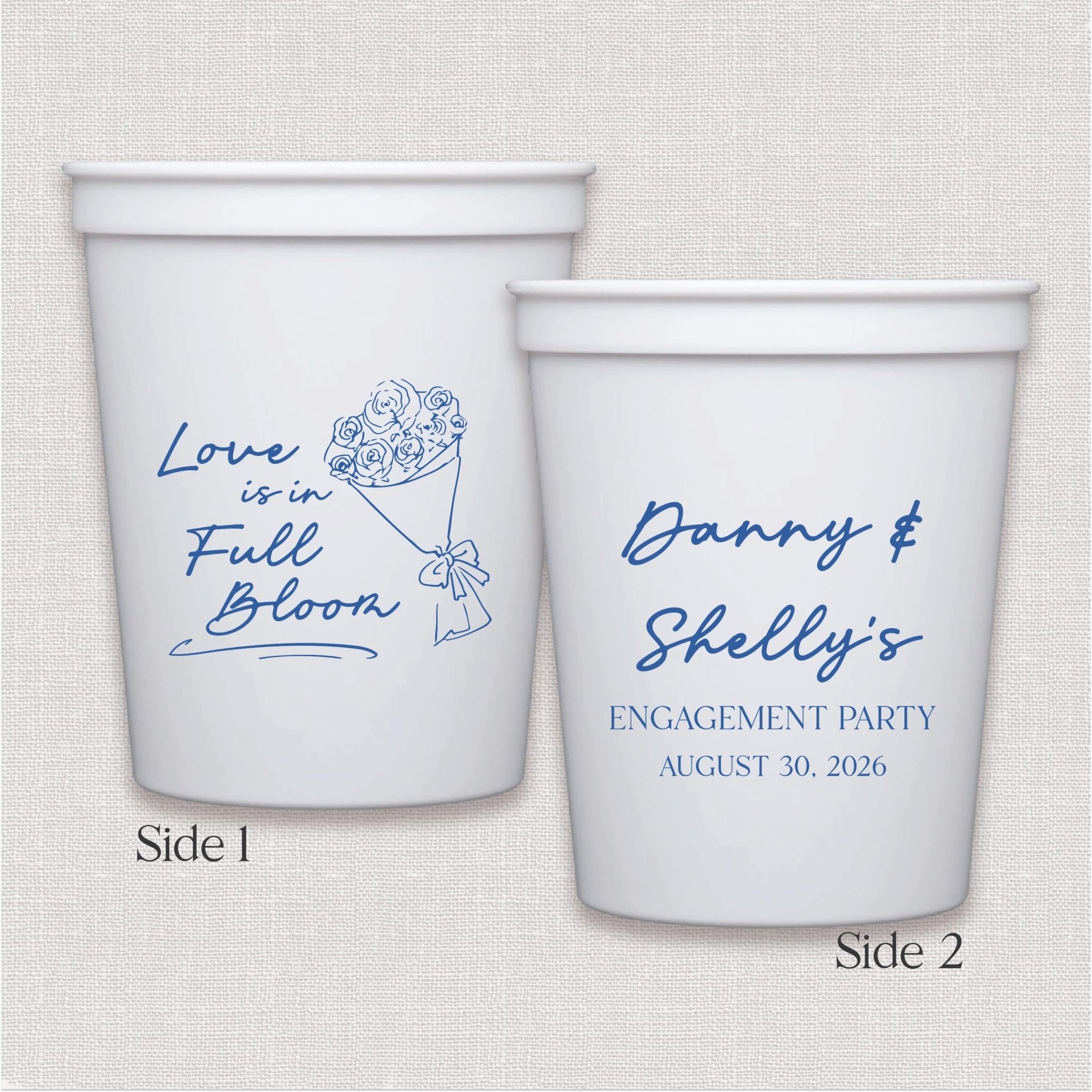 White stadium cup with blue floral design and personalized engagement party text on two sides