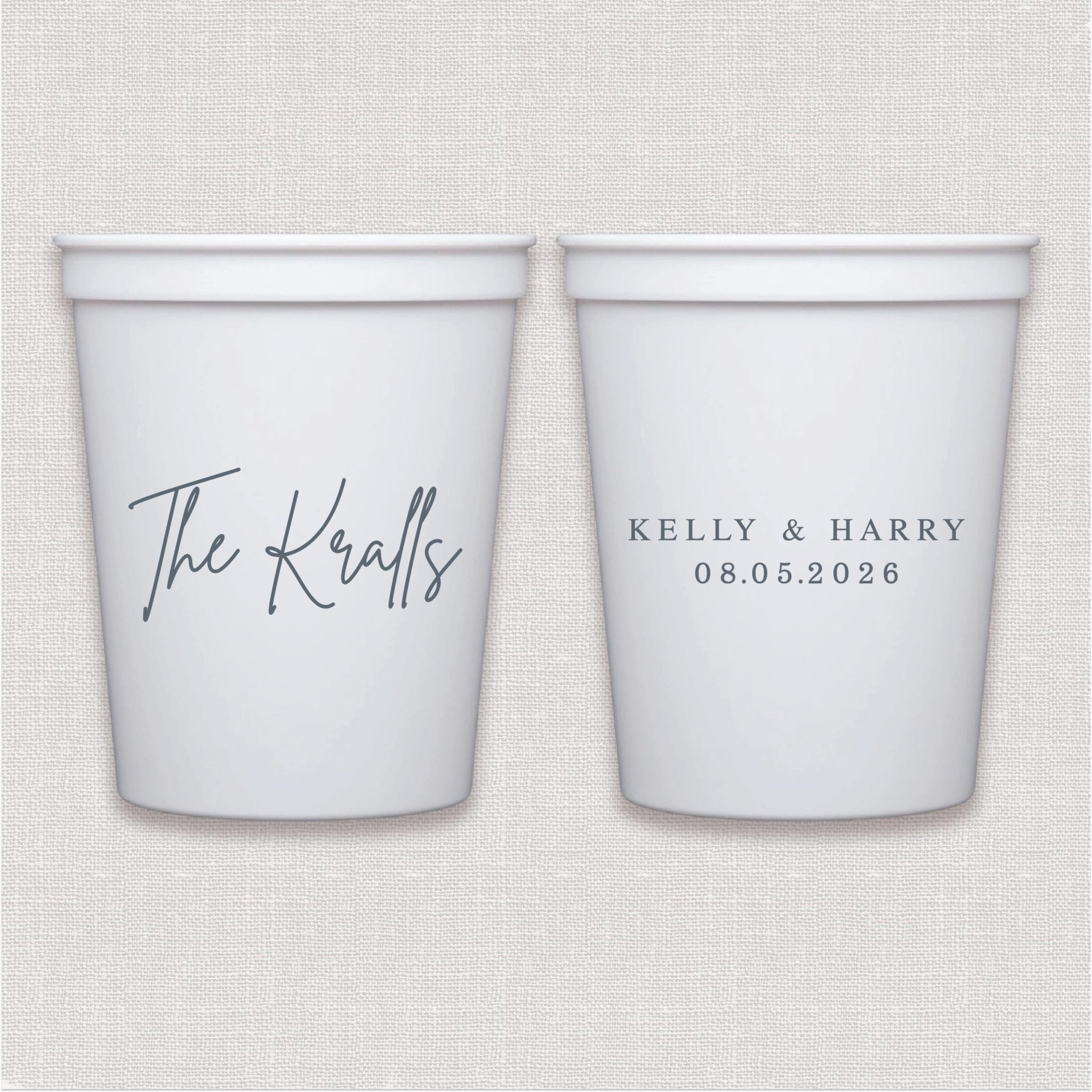 White stadium cups with script couple names and wedding date in navy ink