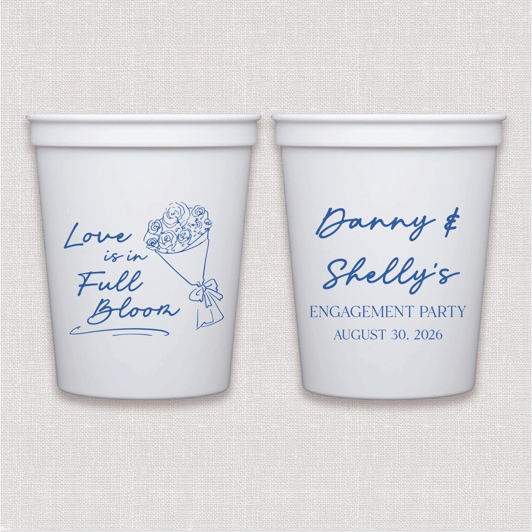 White stadium cup with blue floral and script wedding engagement design