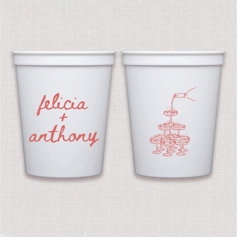 White stadium cup with coral script couple text and champagne tower design