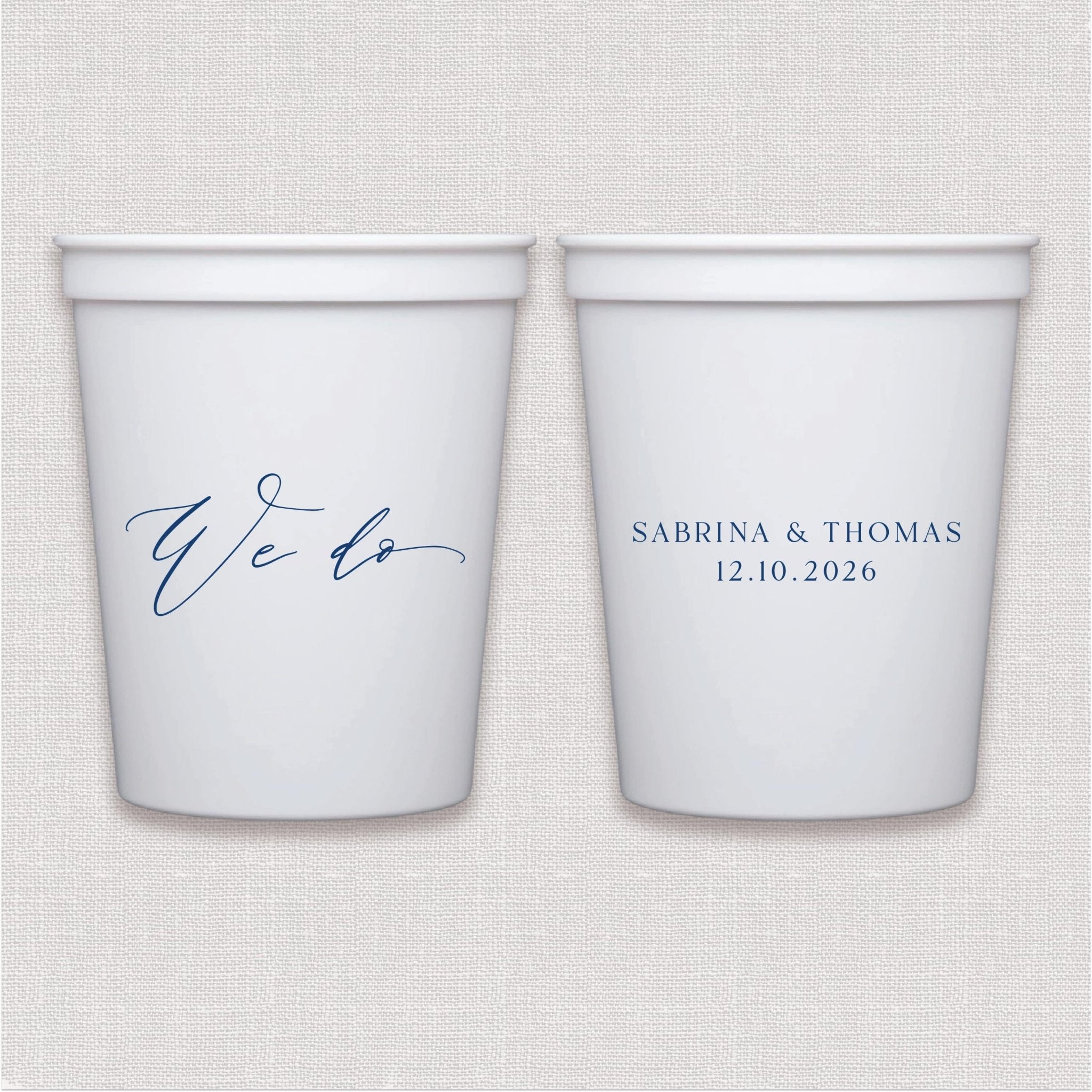 White stadium cups with navy script wedding text and couple names with date