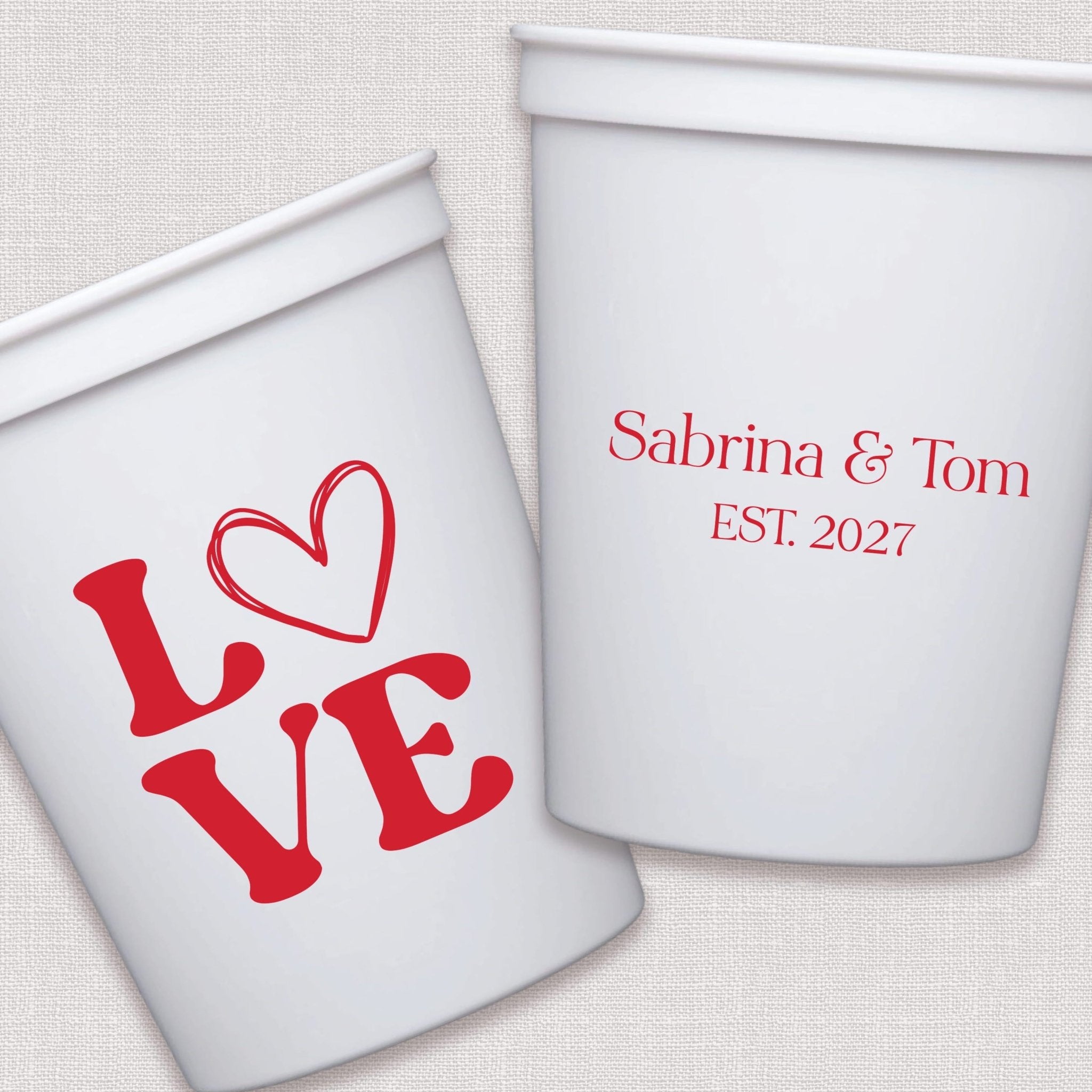 White stadium cups with red LOVE heart design and personalized wedding couple names with established date in script text