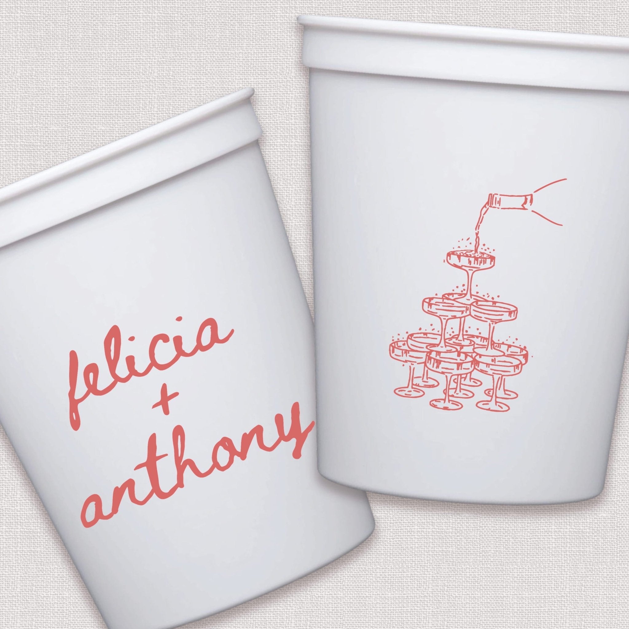 White stadium cups with coral champagne tower and personalized wedding text design