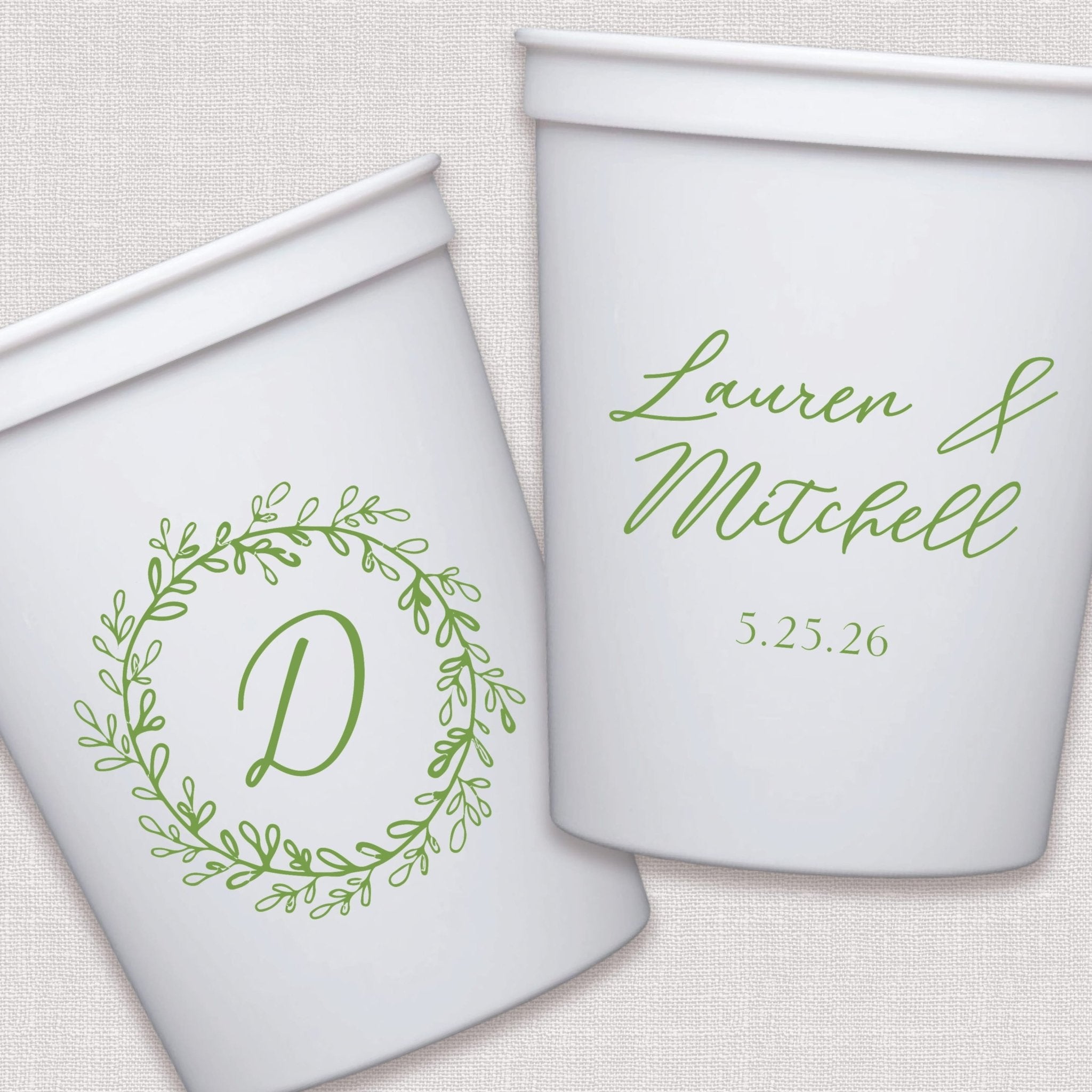 White stadium cups with sage green floral wreath monogram and personalized wedding text design