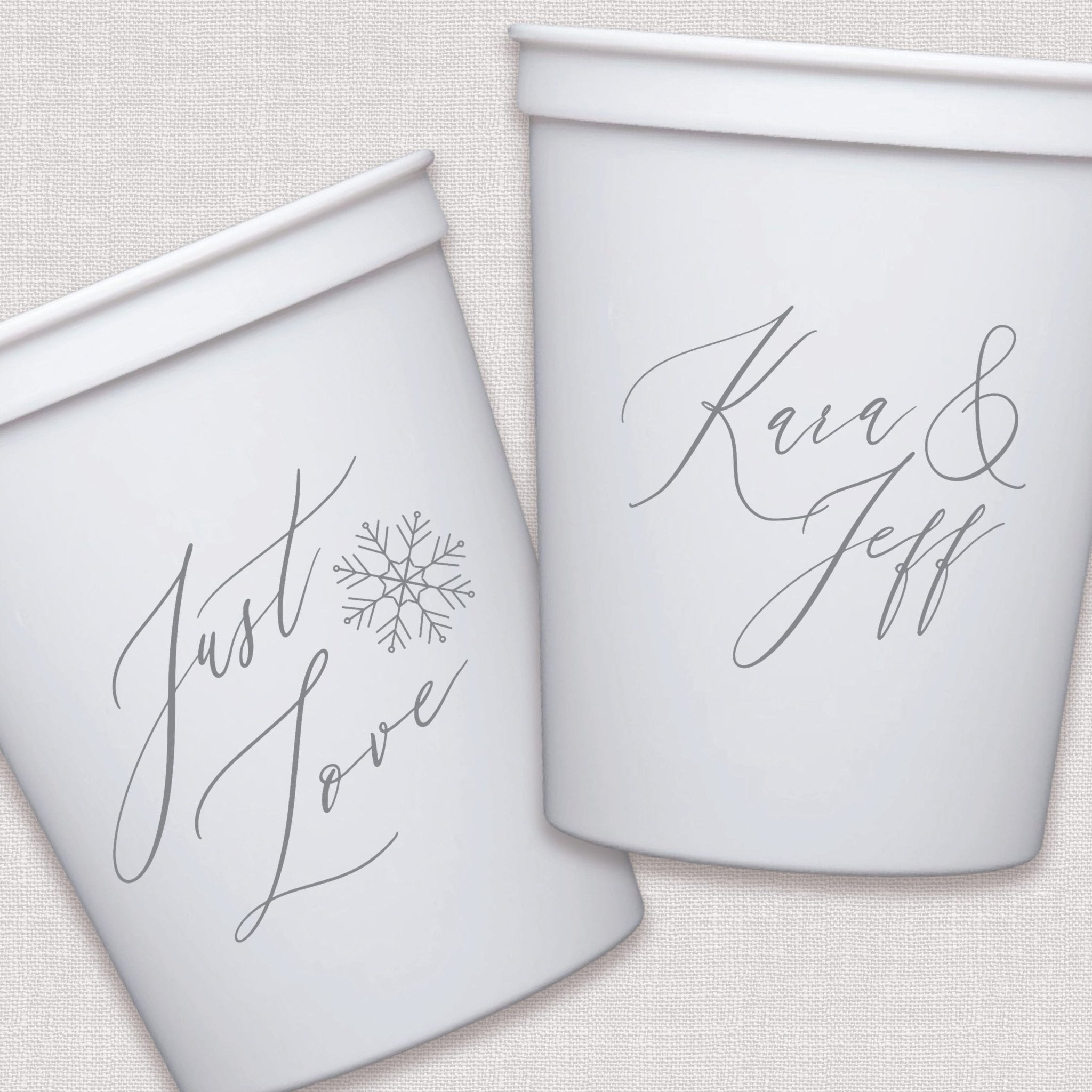 White stadium cups with personalized script text and snowflake design
