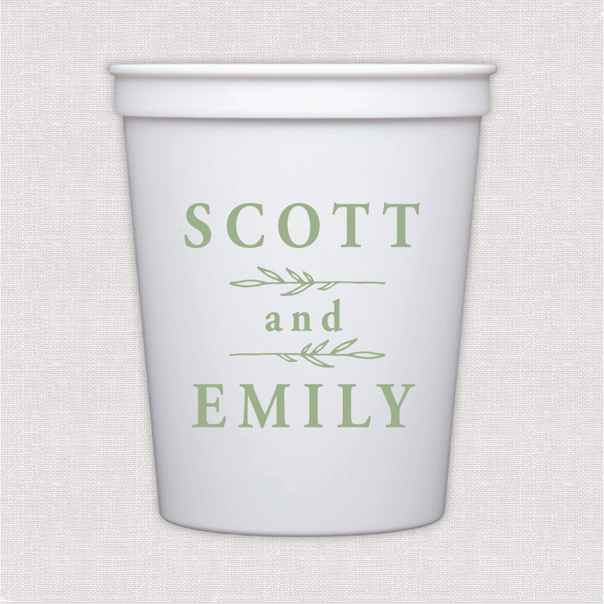 White stadium cup with sage green personalized couple names and botanical leaf design