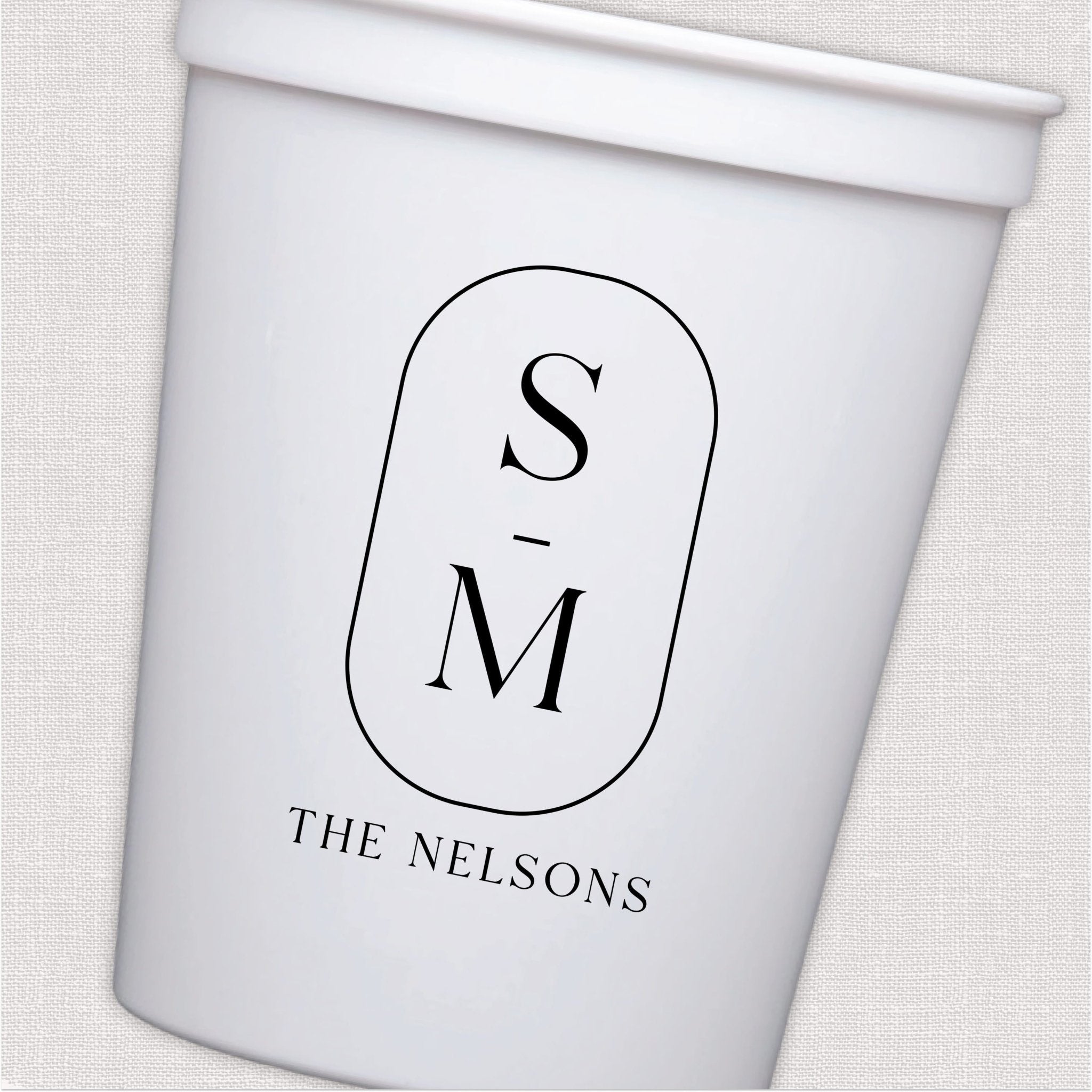 White stadium cup with modern monogram initials and personalized family name design in black script