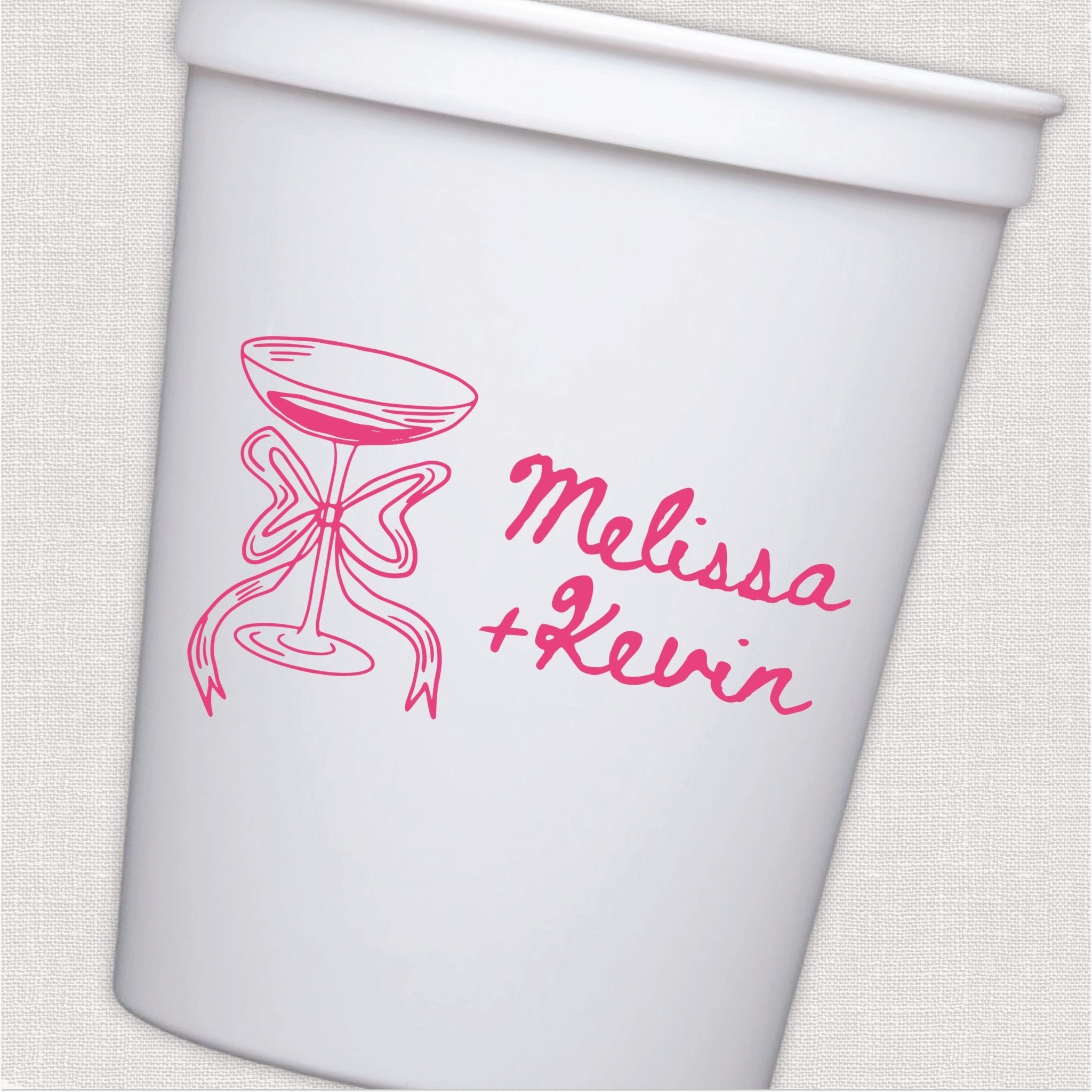 White stadium cup with hot pink champagne glass and bow wedding design