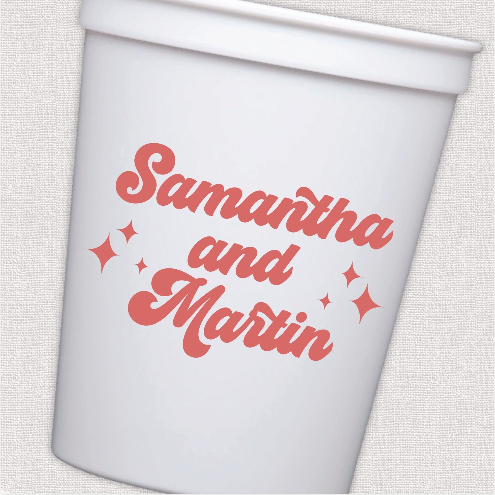 White stadium cup with coral retro script wedding text and sparkle design