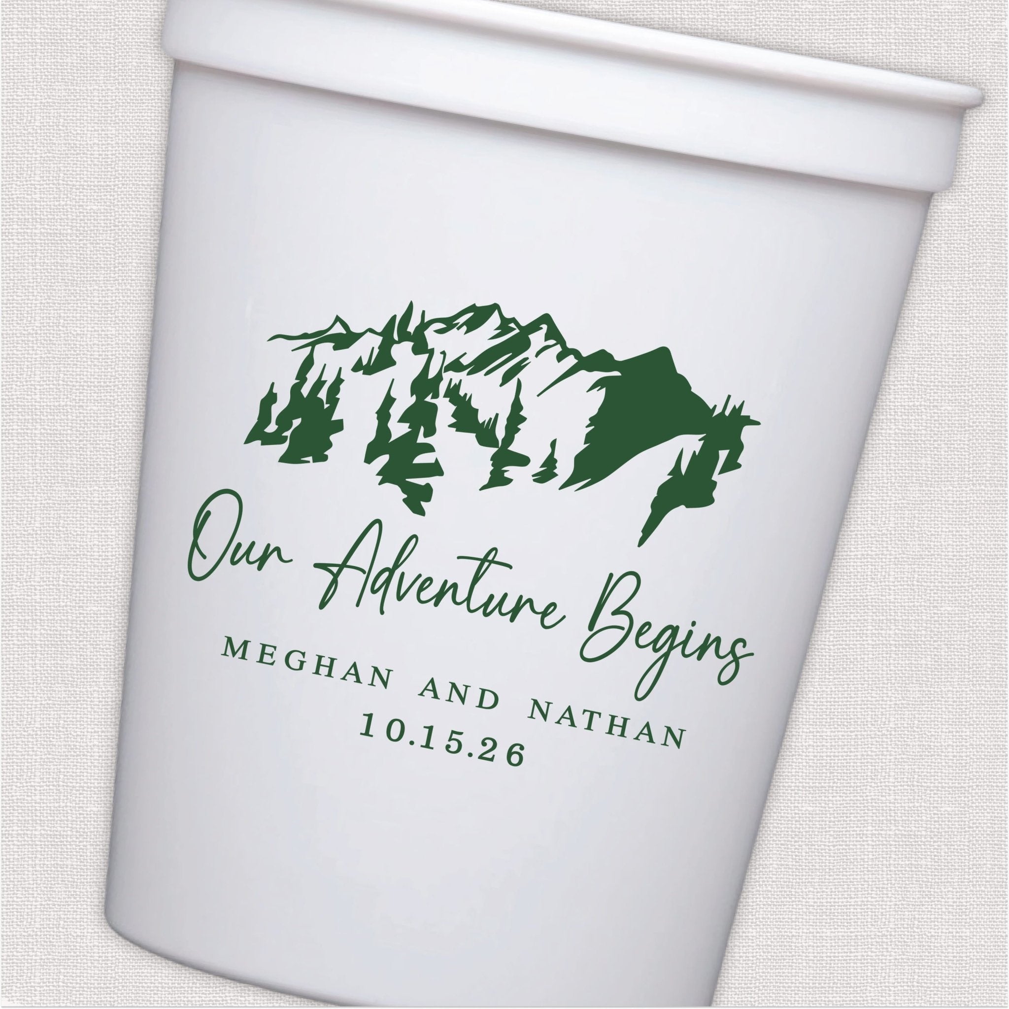 White stadium cup with mountain pine tree design and personalized wedding text in sage green script