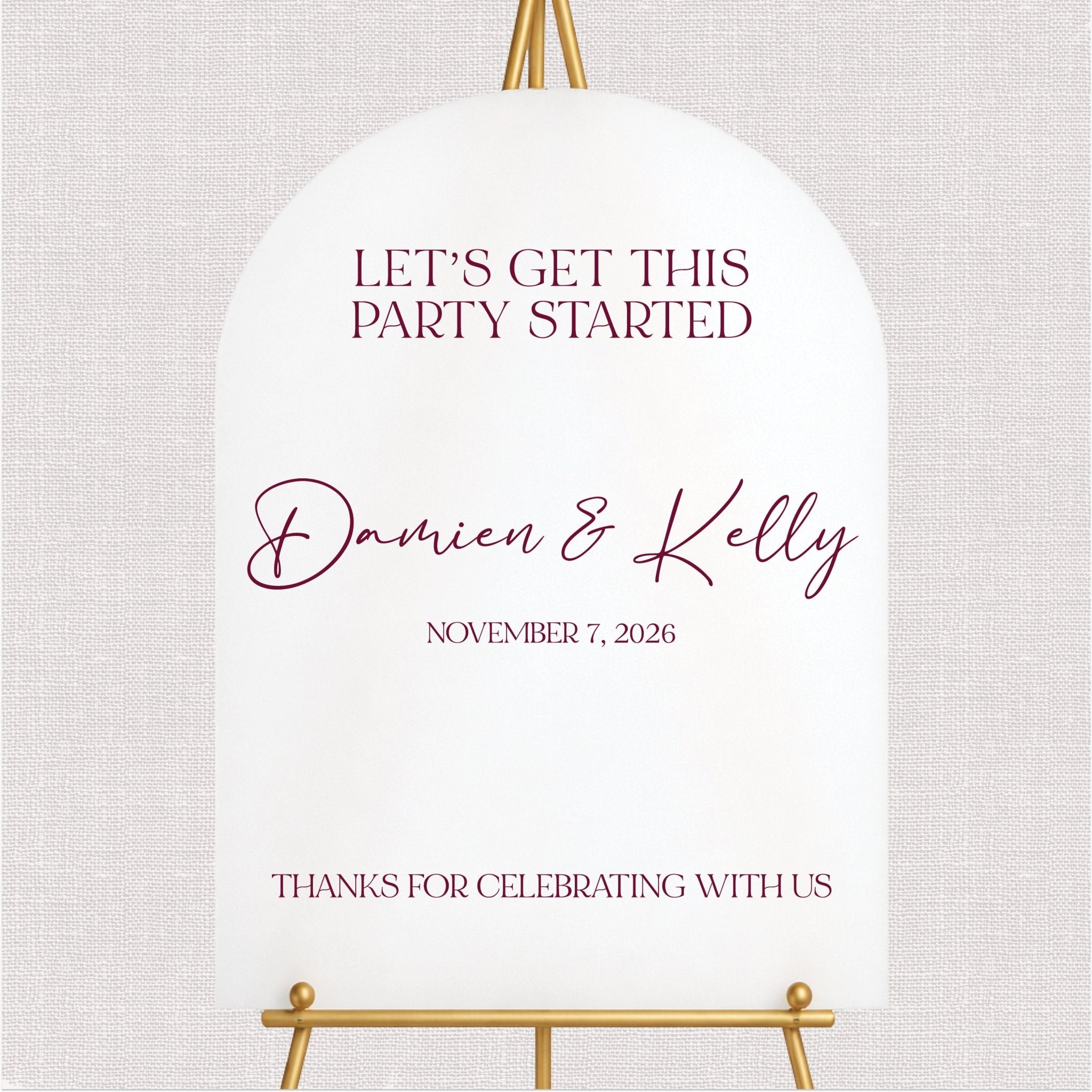 White welcome sign with burgundy script text and personalized couple names, party started design