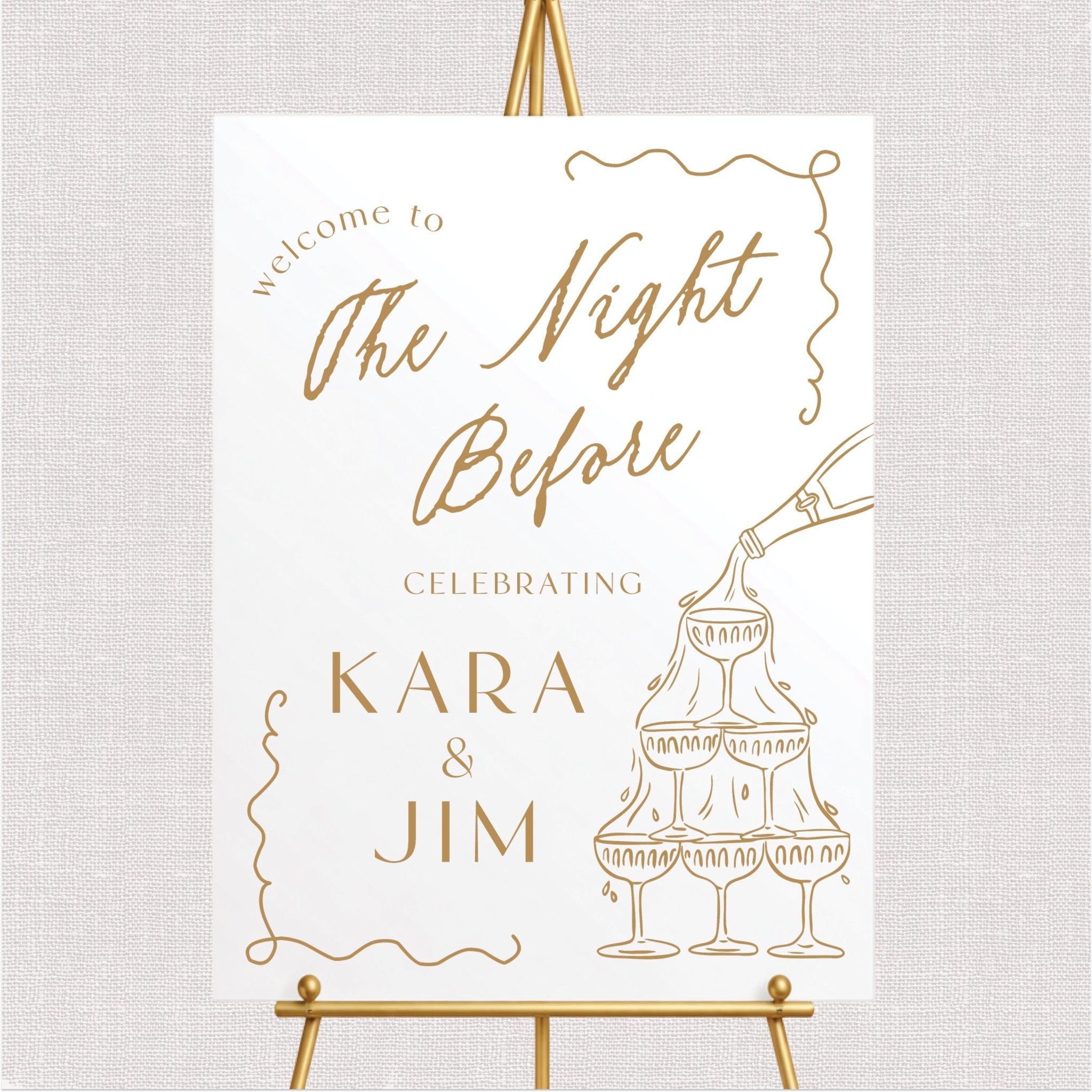 White welcome sign with gold champagne tower and script text design for rehearsal dinner