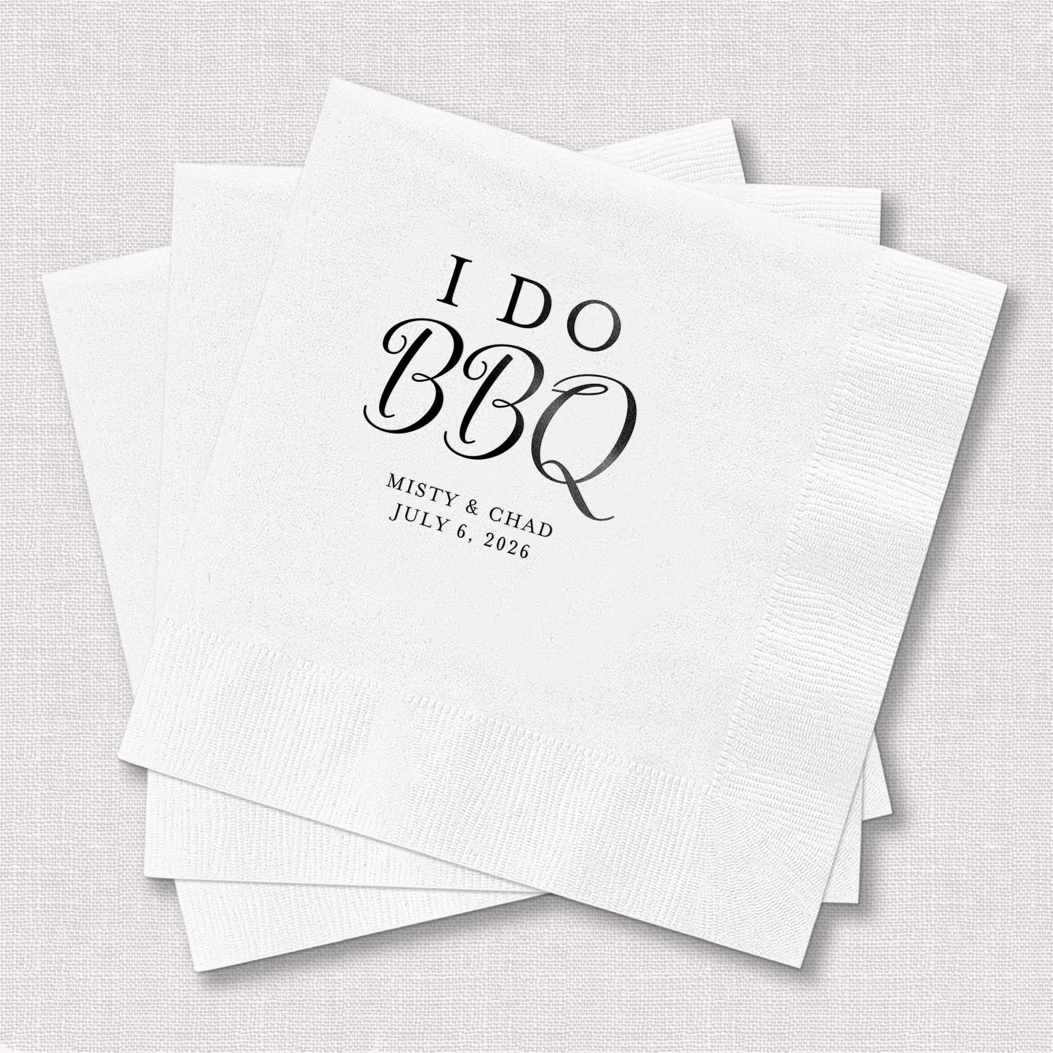 White napkins with "I Do BBQ" text and personalized names and date in black foil stamping