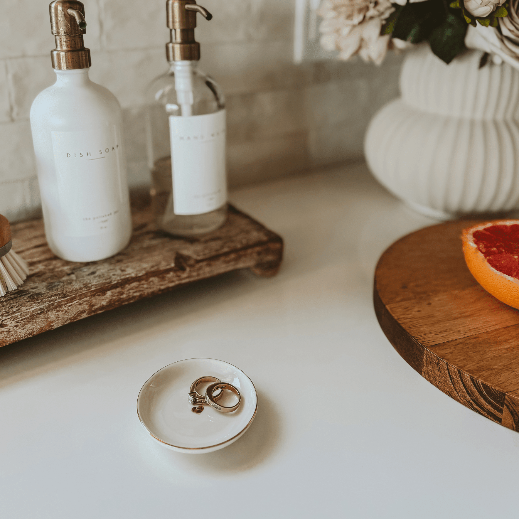 Small white ceramic dish with gold heart design, perfect for holding rings and jewelry