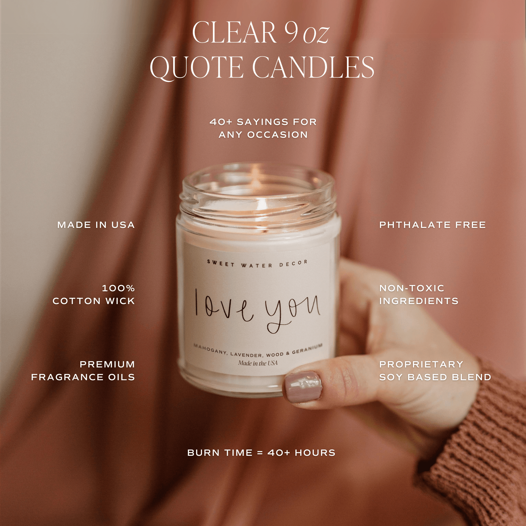 Clear 9 oz soy candle jar with "love you" text, displayed with product features including 40+ sayings, cotton wick, and phthalate-free ingredients on warm fabric background.