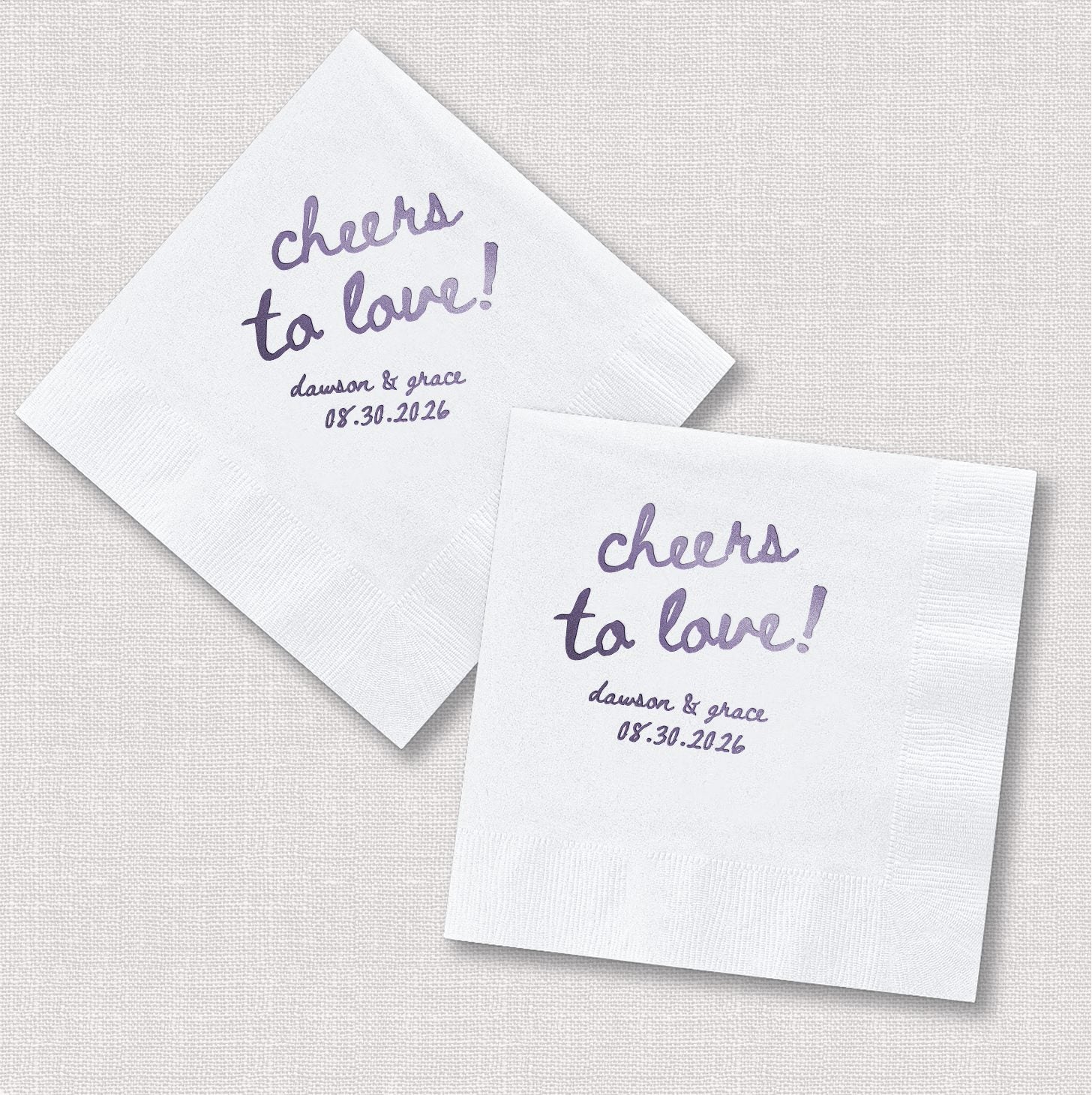 Personalized cocktail napkins in square and diamond orientation showing Cheers to Love wedding desig