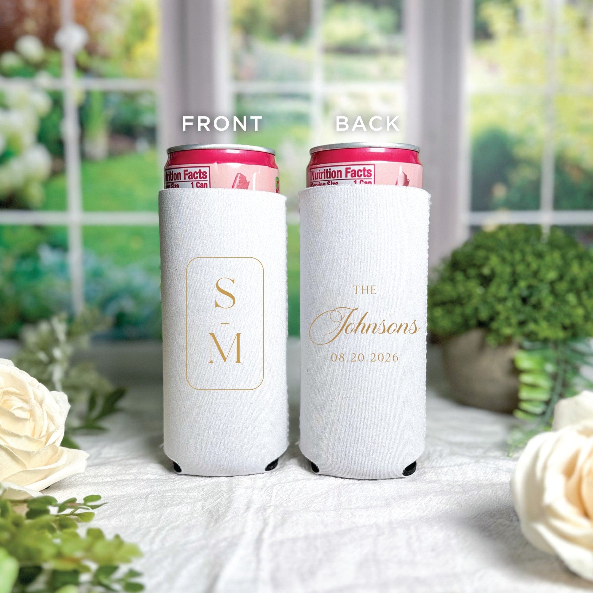Two white personalized slim can koozies made from insulating fabric, designed to keep beverages cold at a wedding or special event.