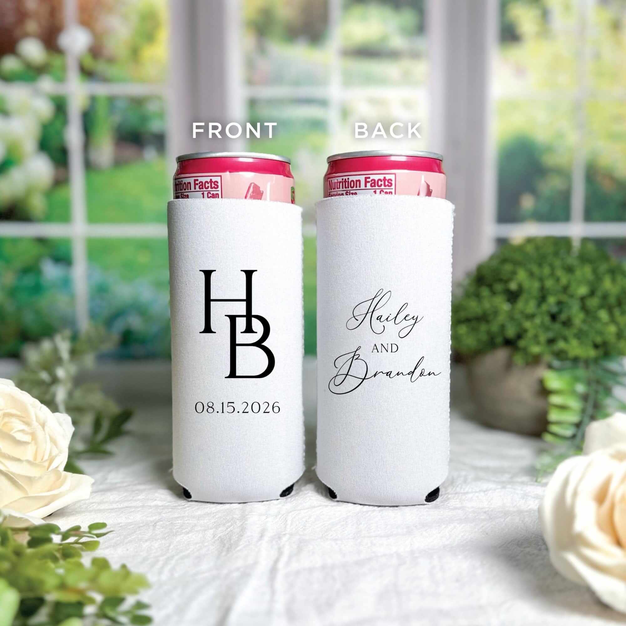 Two white neoprene slim can koozies featuring custom black text designs, perfect for keeping wedding beverages cool.