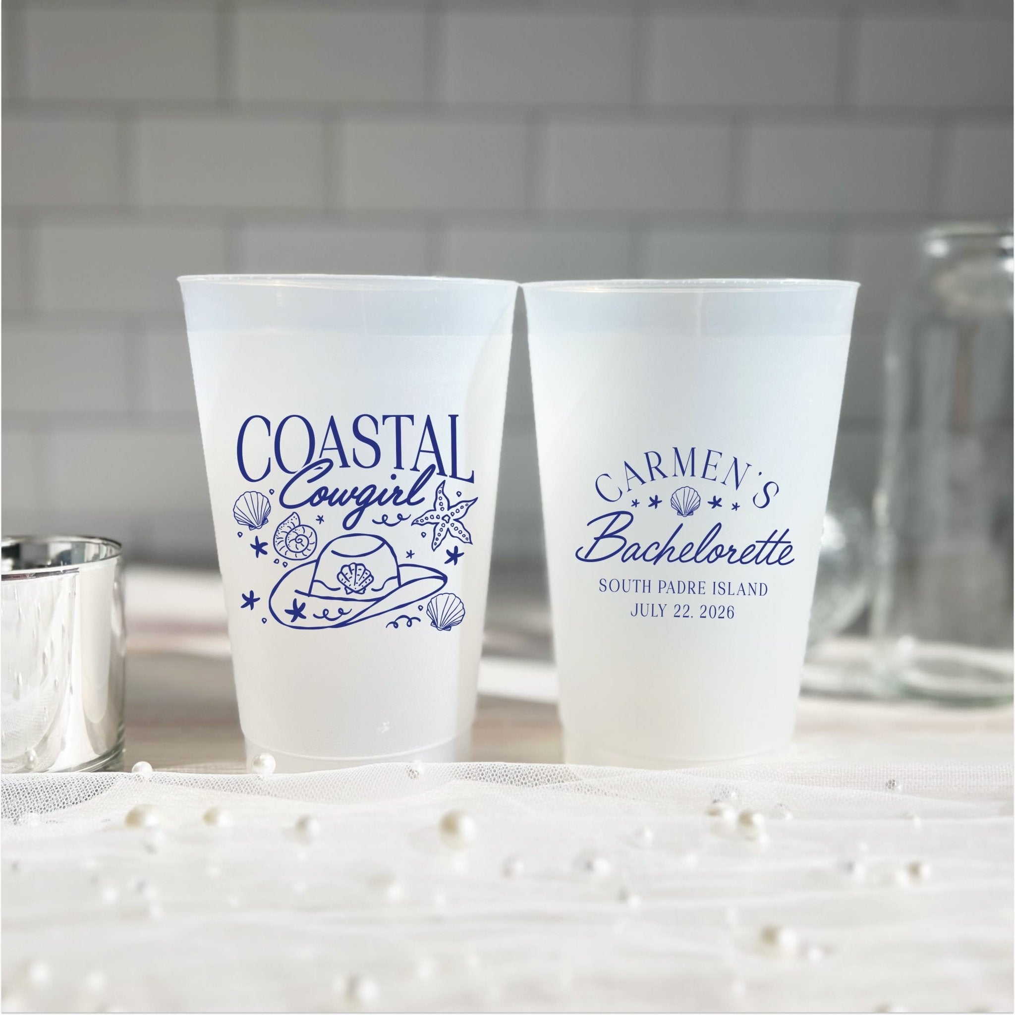 Coastal Cowgirl bachelorette cups in teal ink on a woven placemat