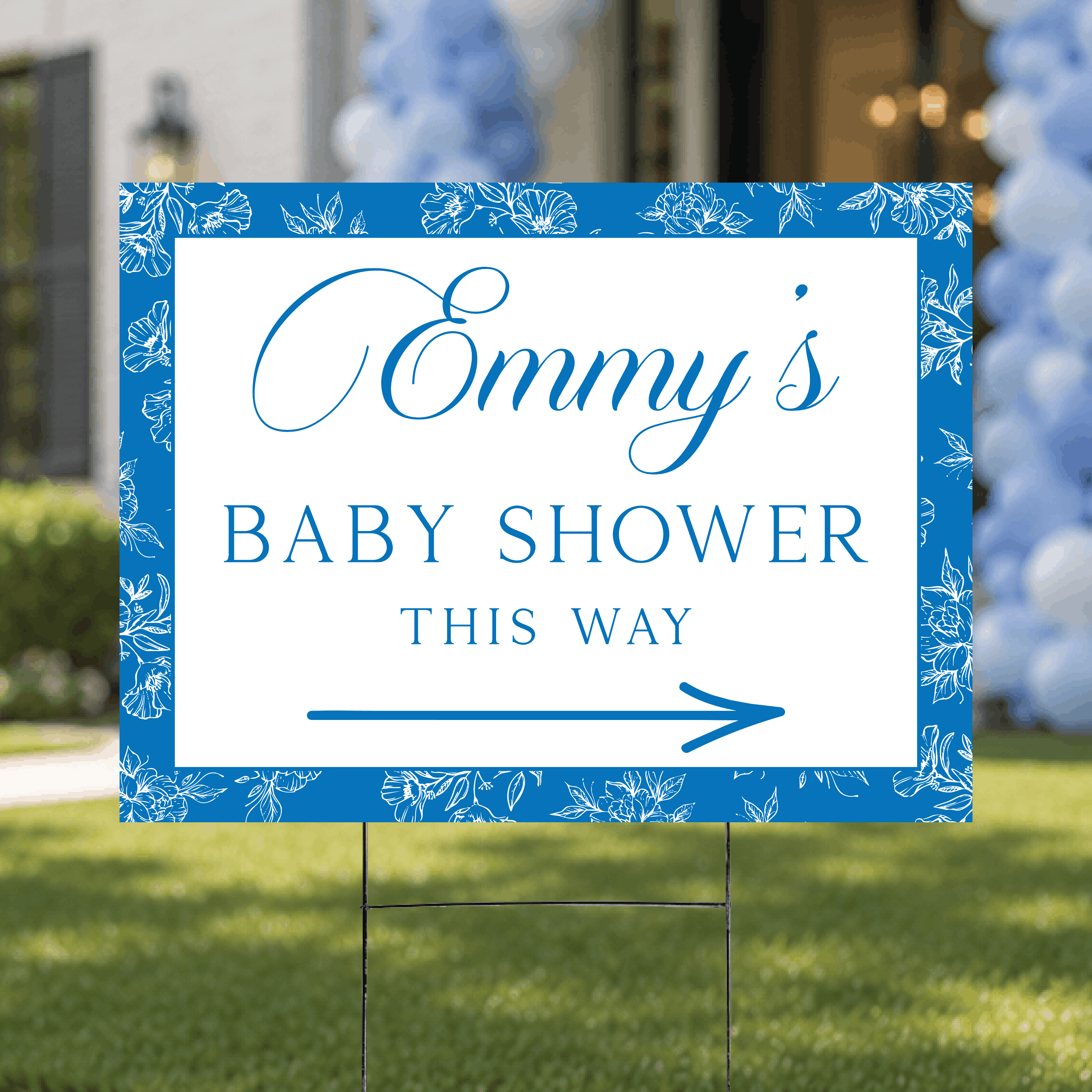 Styled flat lay of a personalized floral toile baby shower directional yard sign, highlighting the elegant toile pattern and custom ink color arrow design.