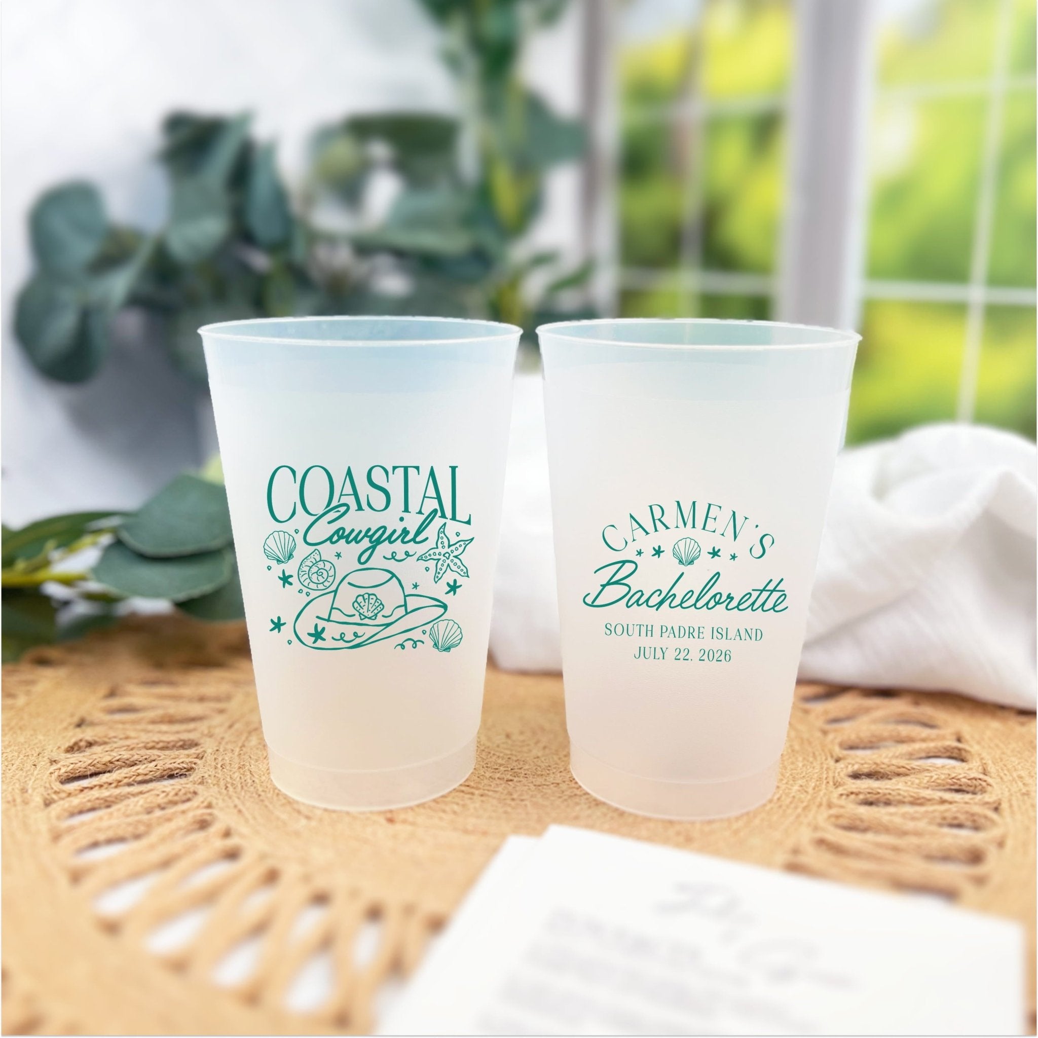 Coastal Cowgirl bachelorette shatterproof cups on a tiled counter with greenery