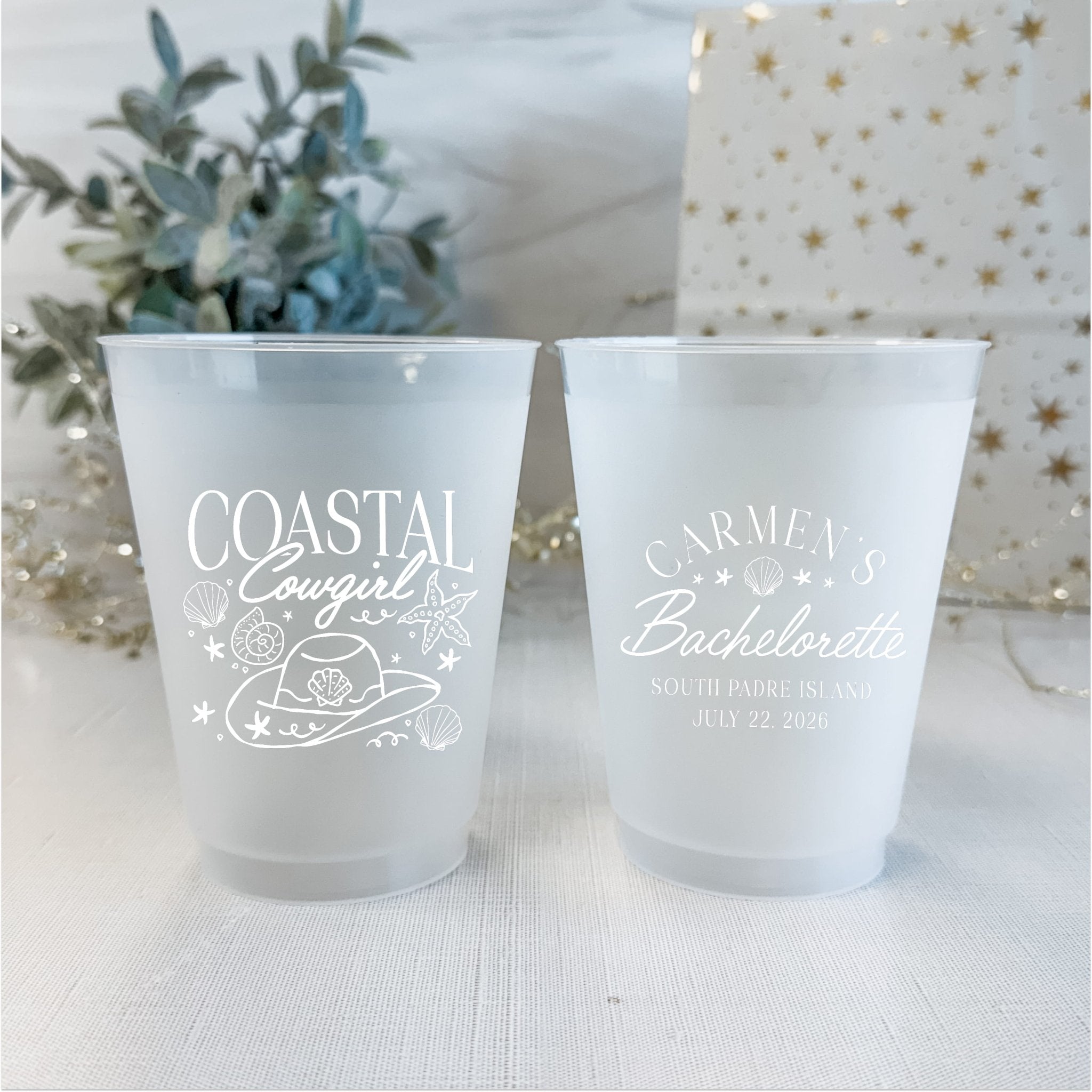 Coastal Cowgirl bachelorette cups styled with florals and a gift box