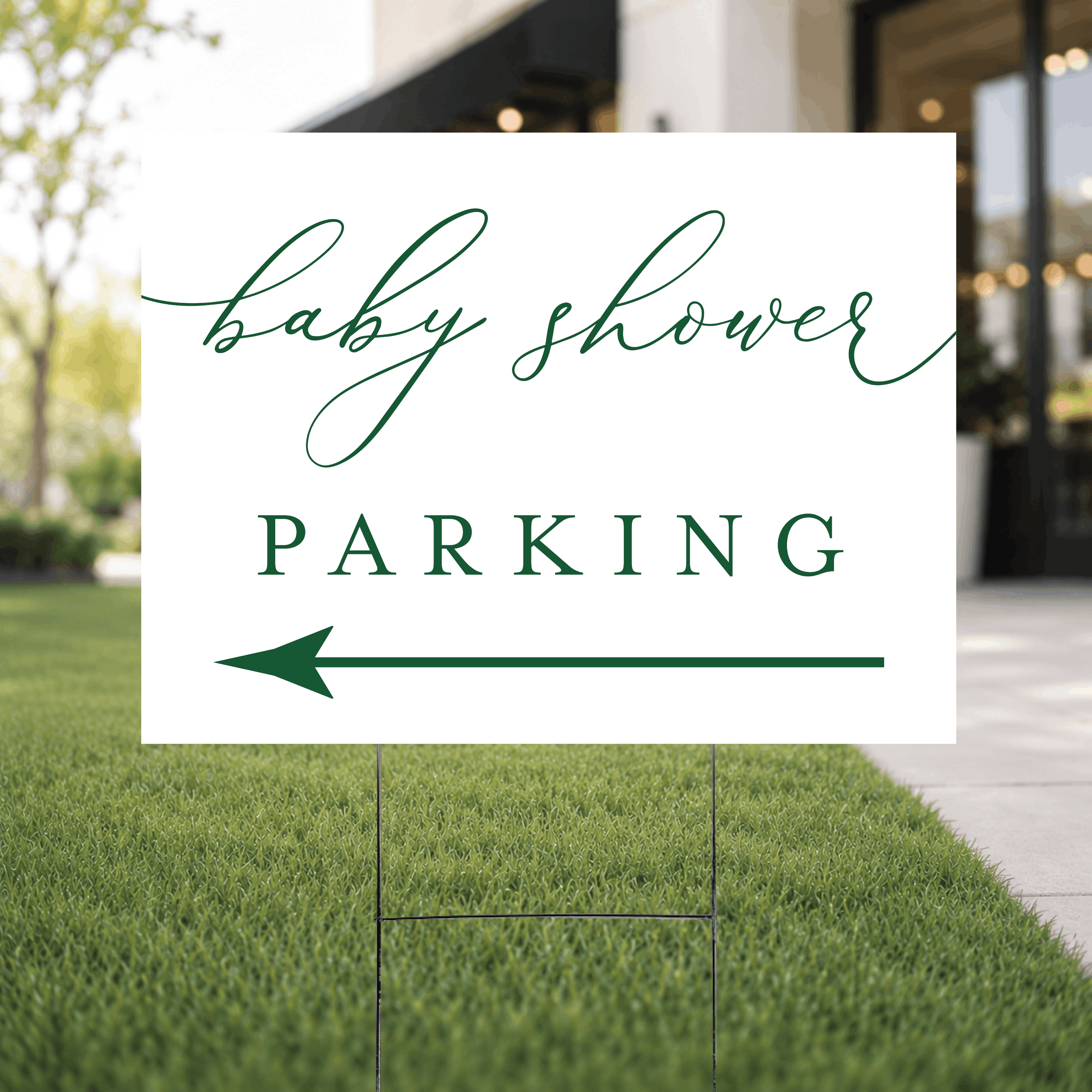 Close-up of a modern script baby shower parking yard sign showing the minimalist white design with baby shower in flowing script and PARKING in bold serif lettering.