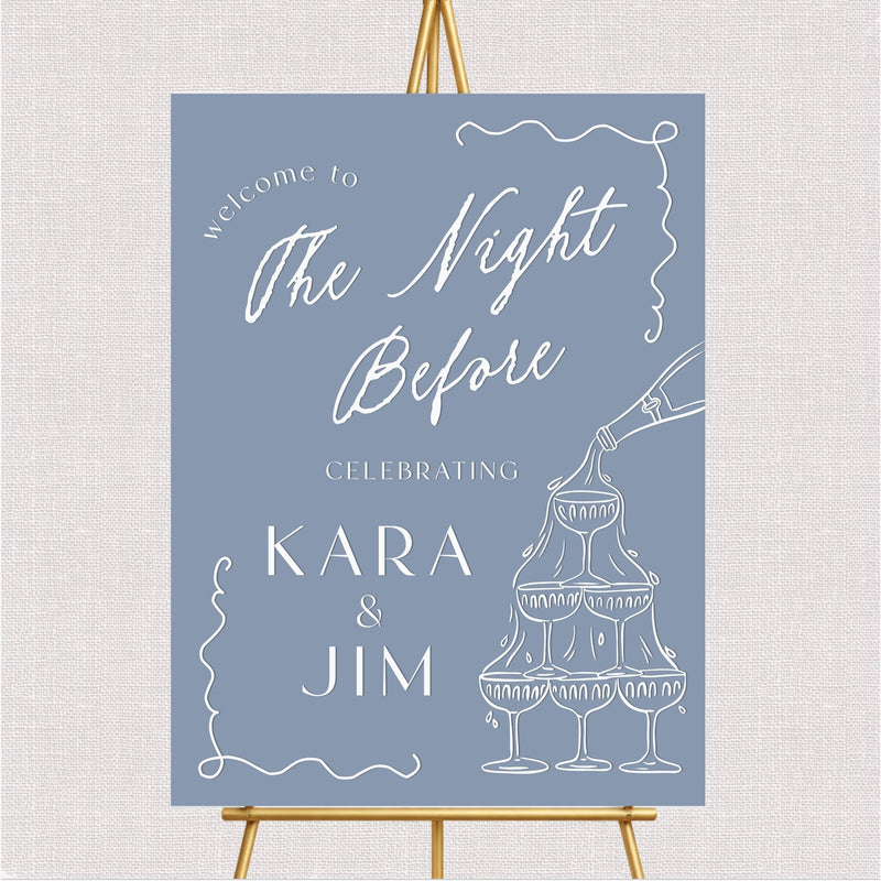 Blue welcome sign with white script text, champagne glasses illustration, and decorative line borders for wedding rehearsa...