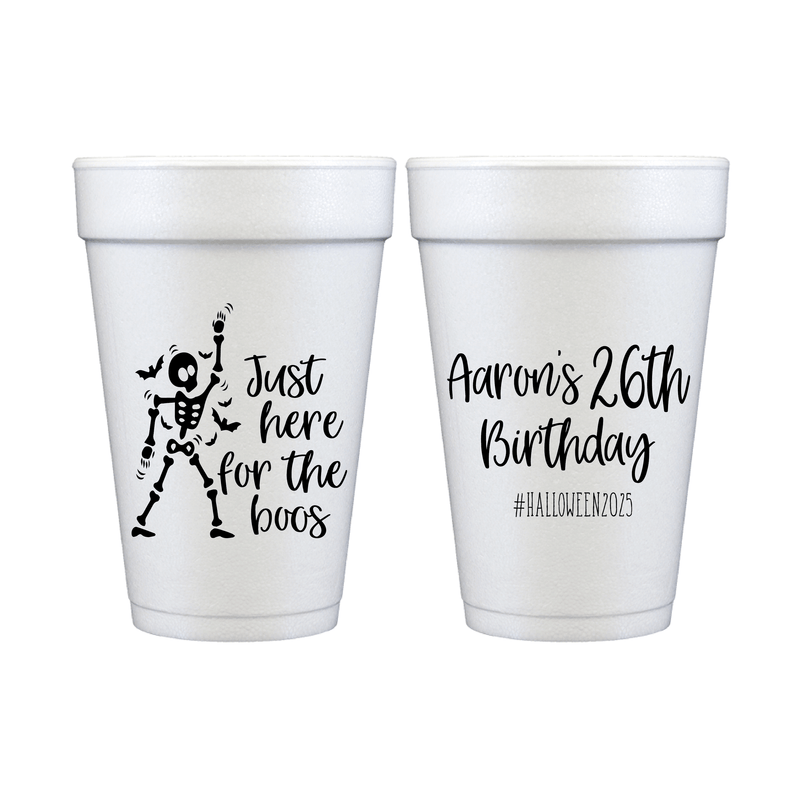 White foam cups with skeleton design saying "just here for the boos" and personalized "Aaron's 26th birthday" text with hashtag