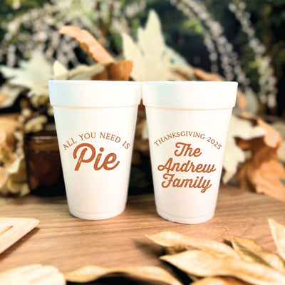 Two white foam cups featuring personalized autumn-themed designs, ideal for disposable drinkware at a Thanksgiving celebration.