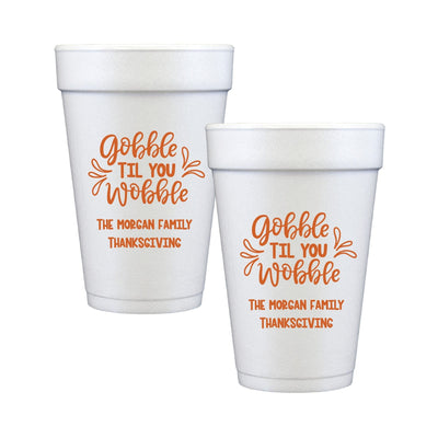 White foam cups customized with orange festive text, designed for Thanksgiving celebrations.