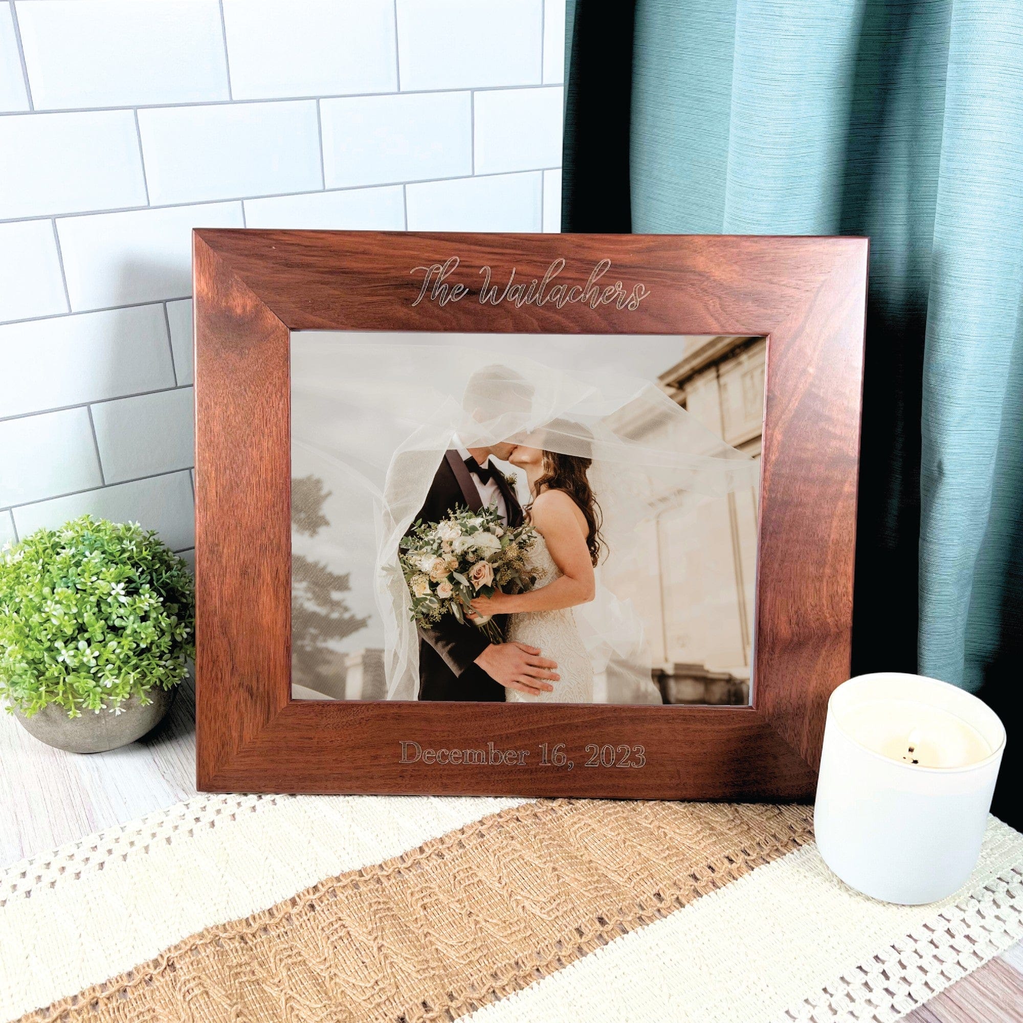 A personalized dark brown wooden wedding photo frame with engraved details, designed to beautifully display a treasured wedding photograph.