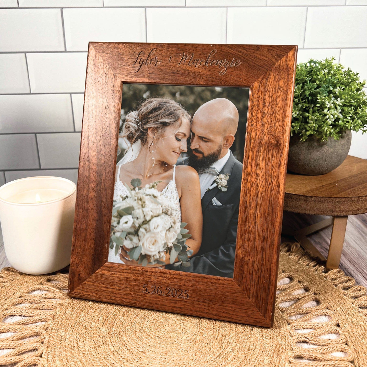 A warm brown wooden photo frame with custom engraving, designed to hold and display a cherished wedding photograph as a personalized keepsake.