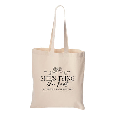 a tote bag with she&#39;s tying the knot on it