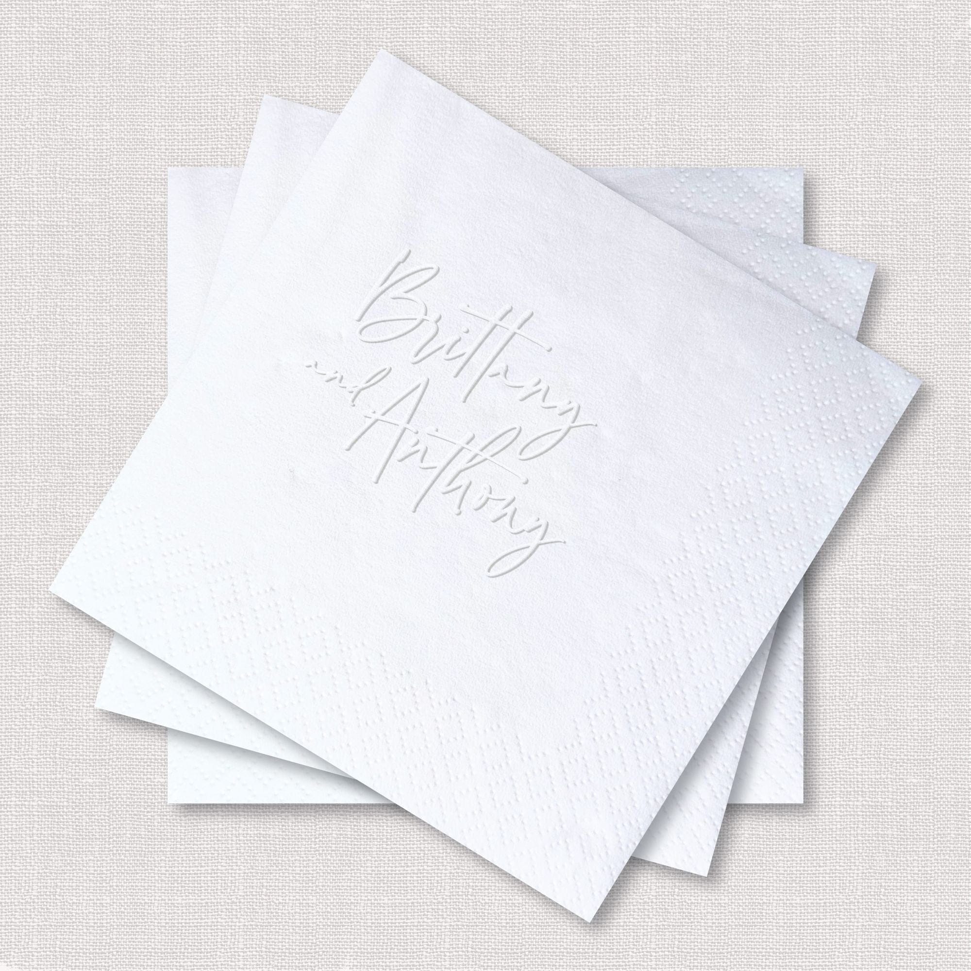 Personalized Embossed Cocktail Napkin Couples Script White Wide Layout Stack Angled View – Rubi and Lib