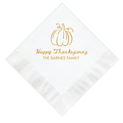 A white paper napkin featuring a golden outline pumpkin illustration, designed as personalized party decor for a fall celebration.