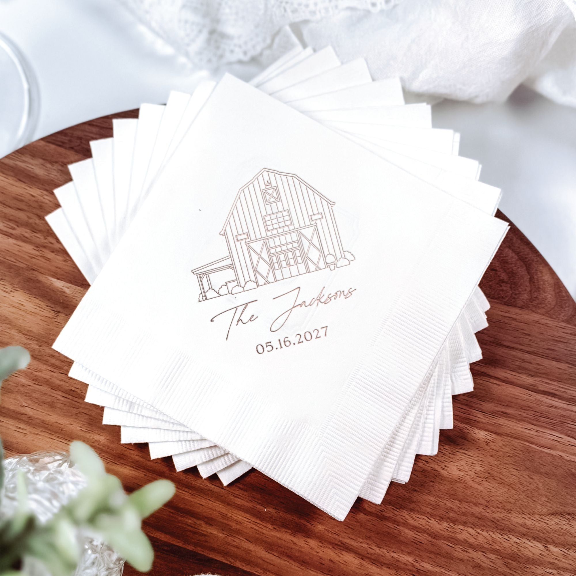 Personalized Illustrated Venue Wedding Napkins Barn Illustration White Stack on Wood with Greenery – Rubi and Lib