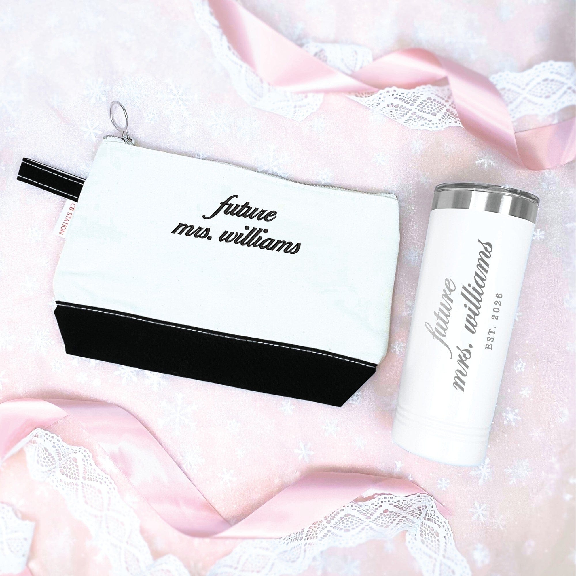 A white and black canvas zippered pouch paired with a white insulated travel tumbler, perfect as a personalized bridal shower or engagement gift for a future bride.