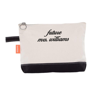 A small, two-tone canvas pouch with a cream top and black bottom, featuring a zippered closure and a side loop, ideal as a personalized gift or accessory for a bridal shower or wedding celebration.