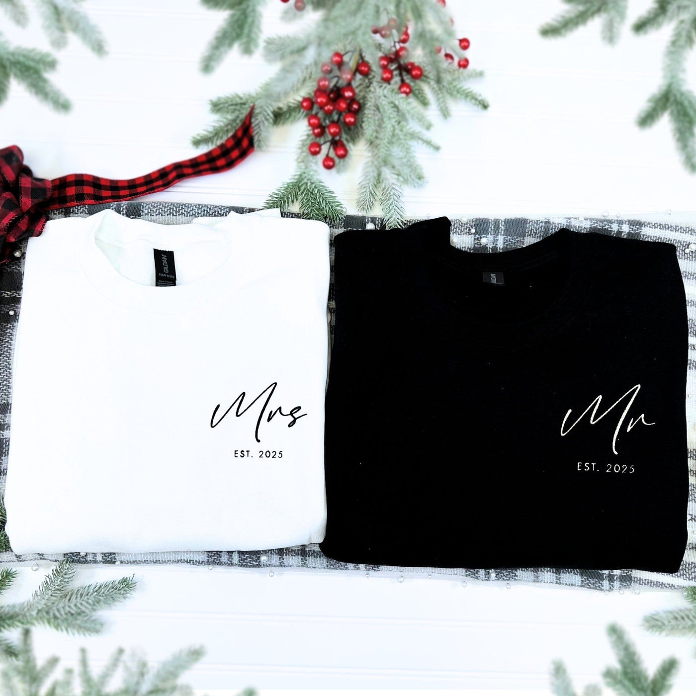 A matching set of a black and a white personalized long-sleeve sweatshirt, made from soft fabric, intended as a thoughtful wedding or engagement gift for a couple.