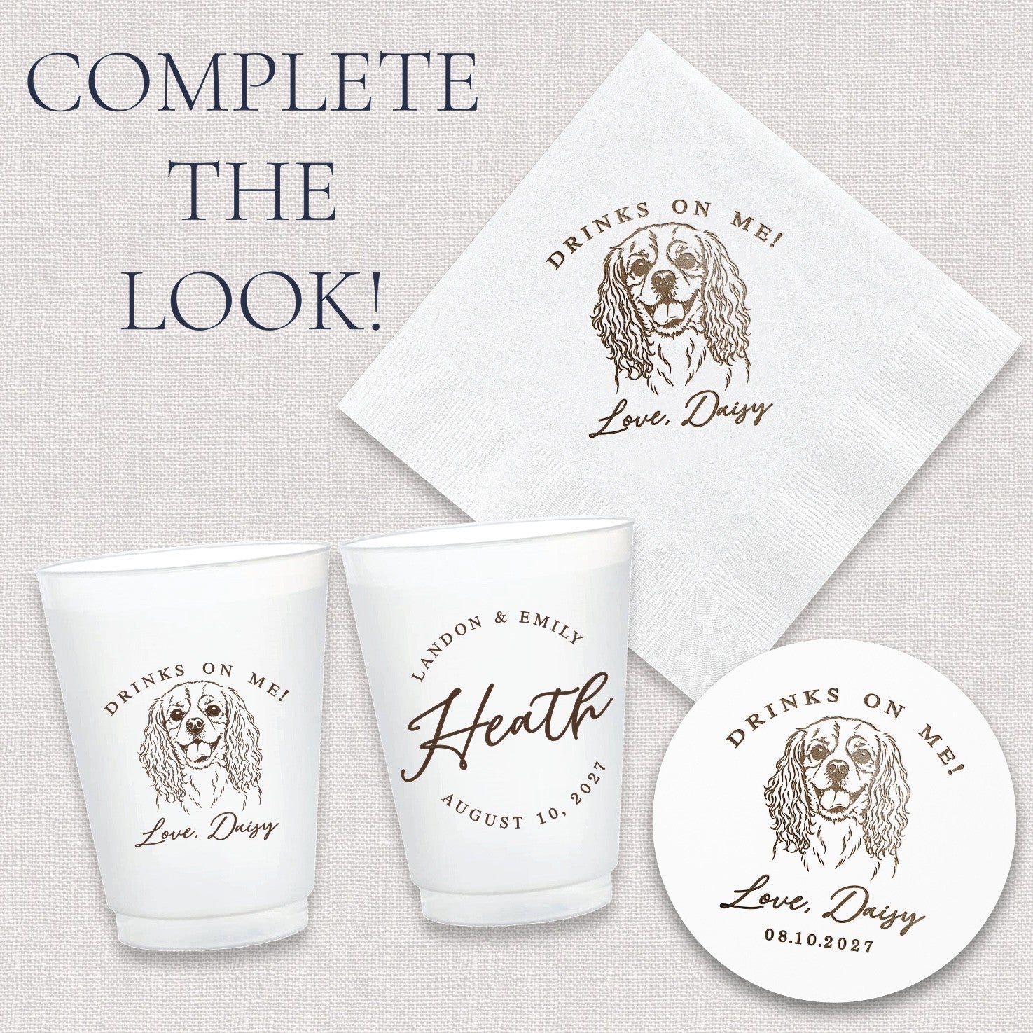 A collection of personalized white event decor including paper cocktail napkins, frosted plastic cups, and round paper coasters, all featuring custom brown printed designs such as a dog illustration, intended for use at a wedding or special event.