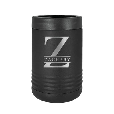 A matte black insulated metal can cooler with a textured finish, featuring a silver engraved initial design, ideal for keeping beverages cold at events.