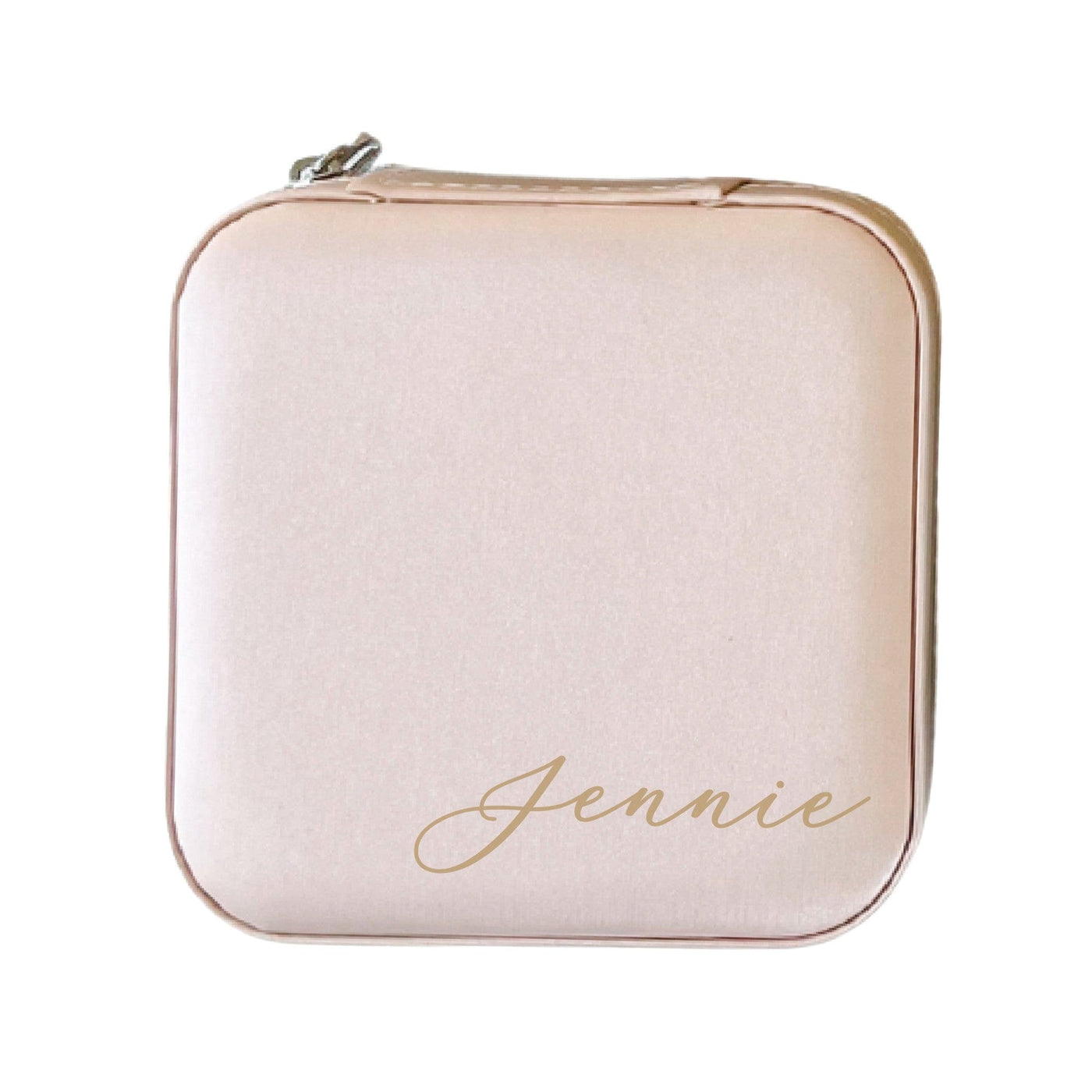 A compact, blush pink zippered jewelry case made from soft material, ideal for storing small accessories or as a wedding party gift.