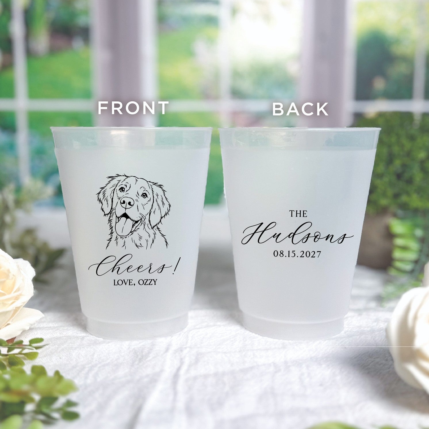 Two personalized frosted shatterproof plastic cups are displayed, one featuring a custom dog illustration on the front and the other showing elegant script on the back, suitable for wedding or event drinkware.