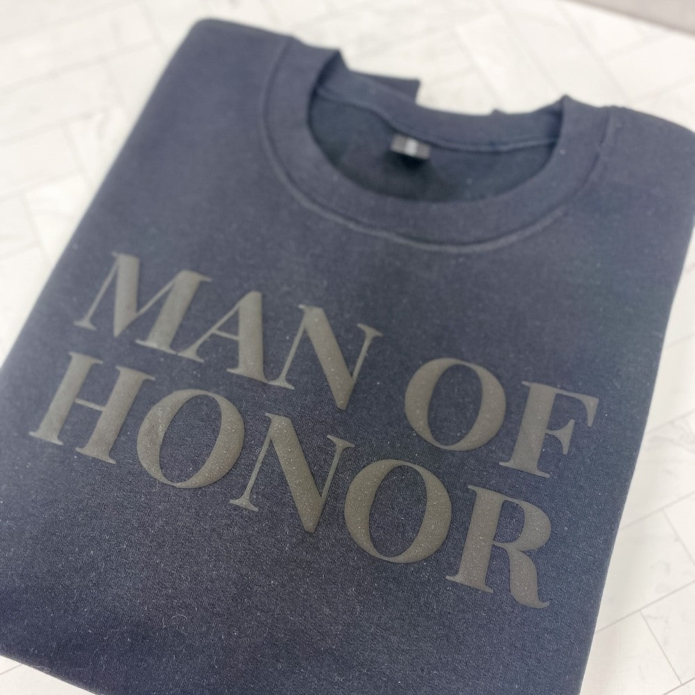 A dark gray crewneck sweatshirt featuring a subtle dark gray textured design on the front, suitable for a wedding event.