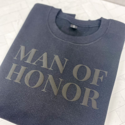 A dark gray crewneck sweatshirt featuring a subtle dark gray textured design on the front, suitable for a wedding event.